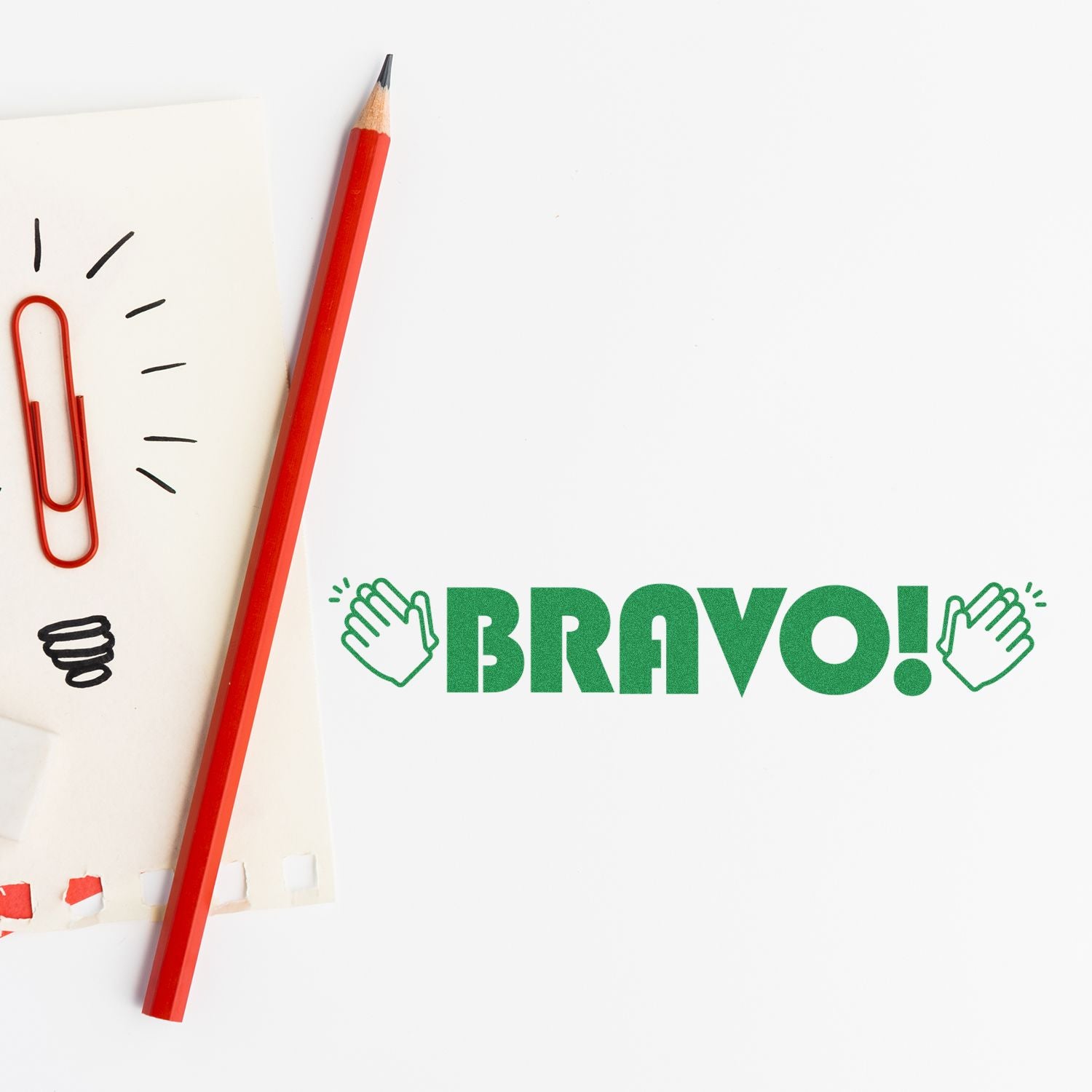 Red pencil and paper with doodles beside green BRAVO! praise graphic, highlighting education success and learning motivation