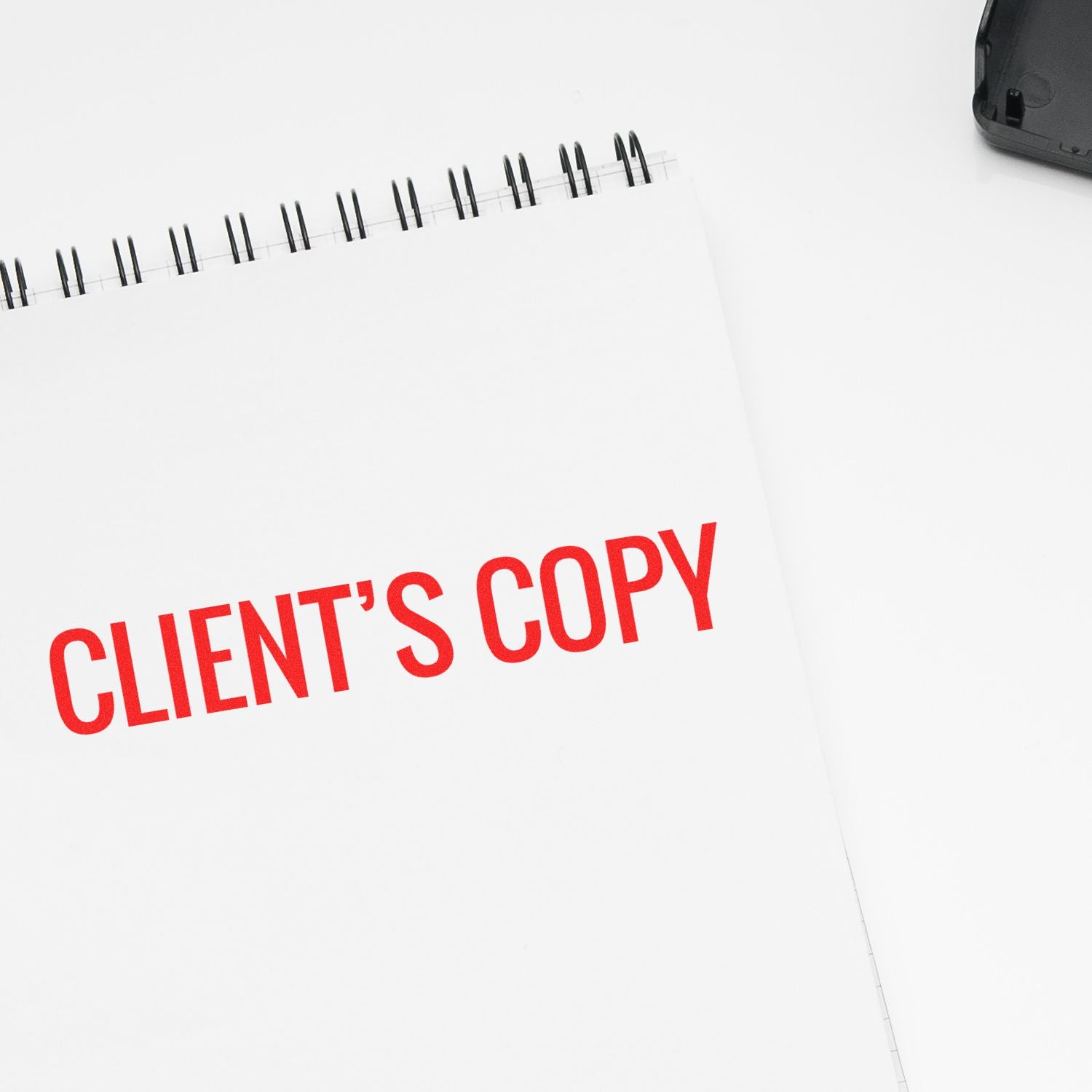 Office notebook page labeled CLIENTS COPY in red, indicating an official client receipt document for records or invoicing.