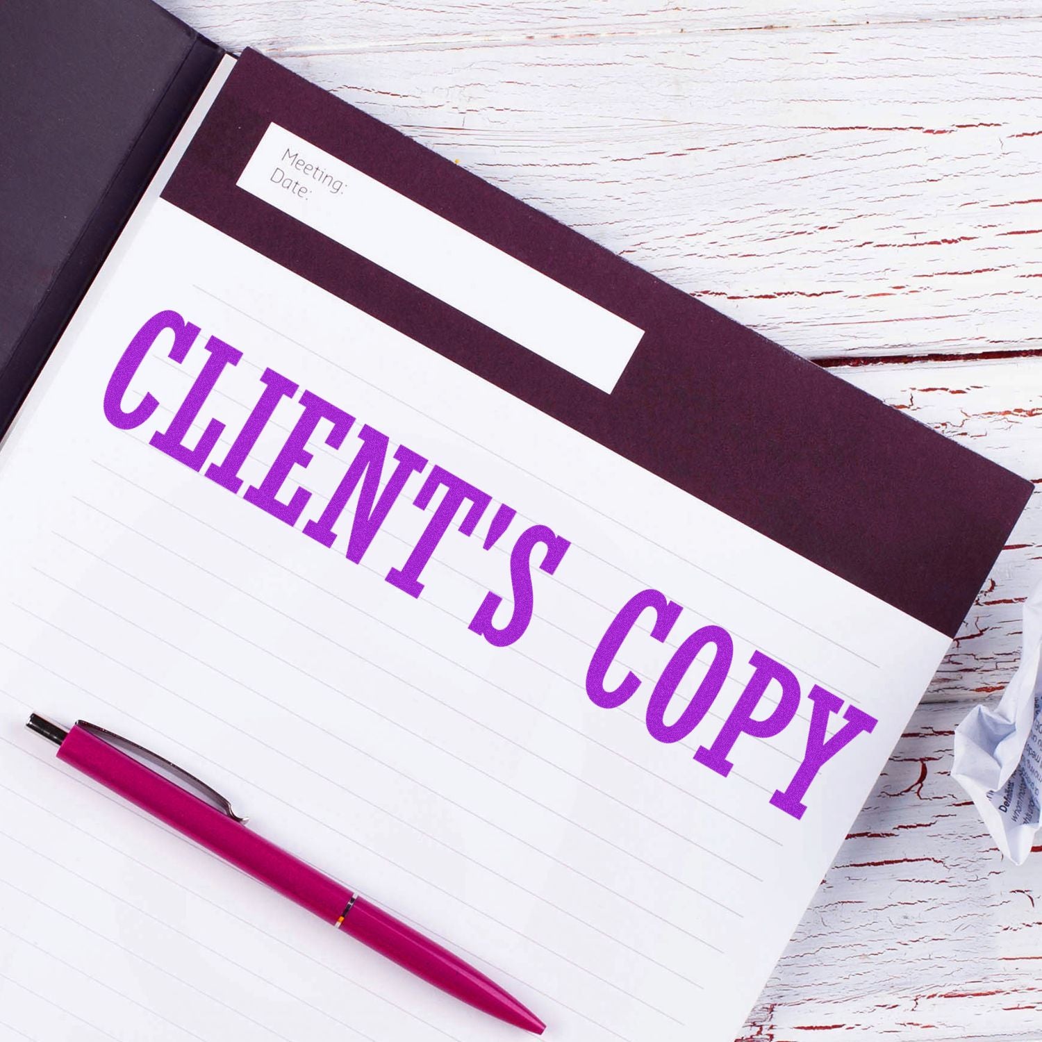 Clients copy notebook with pen on white wooden desk, meeting notes template for business planning.