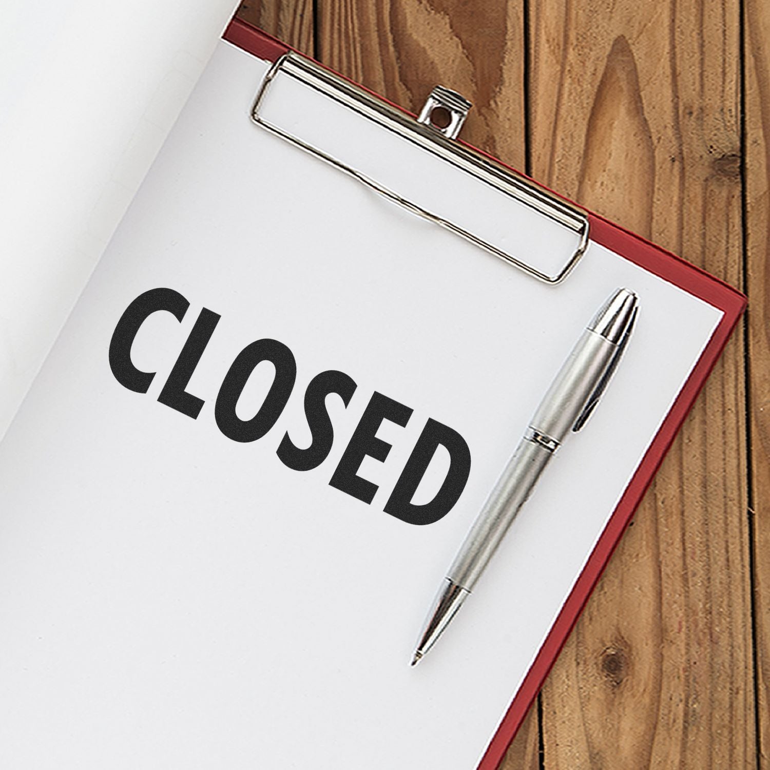 Closed sign notebook with pen on desk, SEO business hours status for office customer service, shipping and availability checklist today