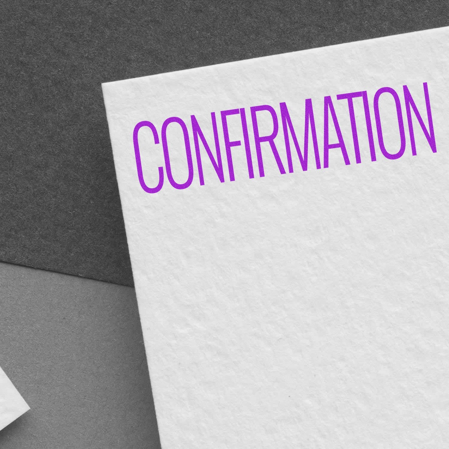 Purple confirmation text on white paper background, close-up business concept image