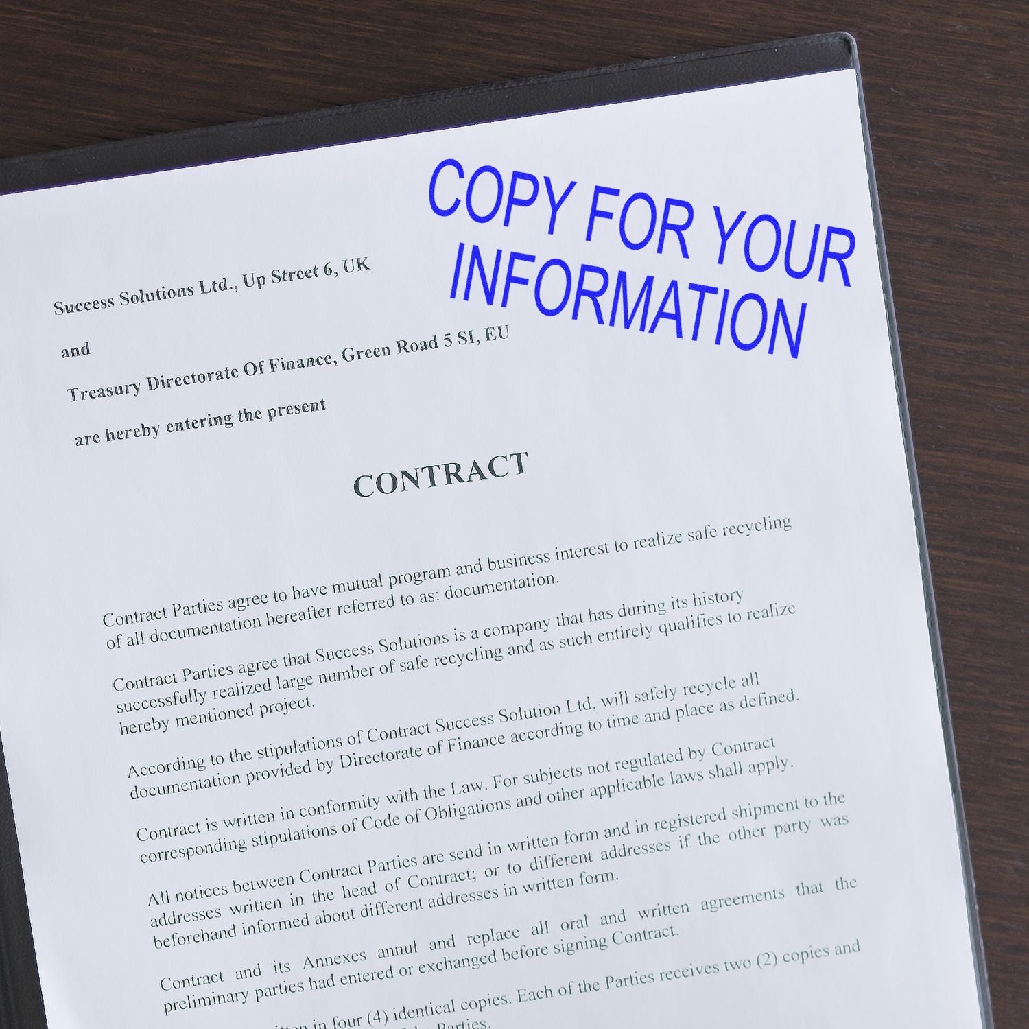 Contract document titled COPY FOR YOUR INFORMATION, showing business terms on paper for formal agreement and legal documentation.