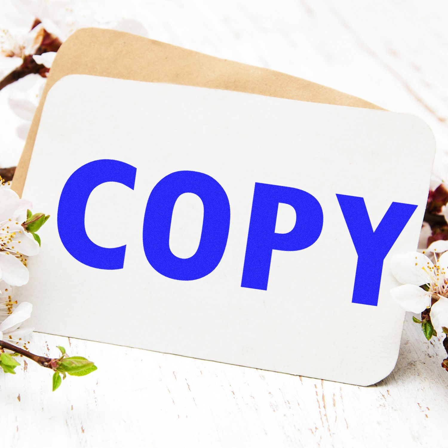 Blue copy text on a white card with spring flowers, highlighting copying and printing services.