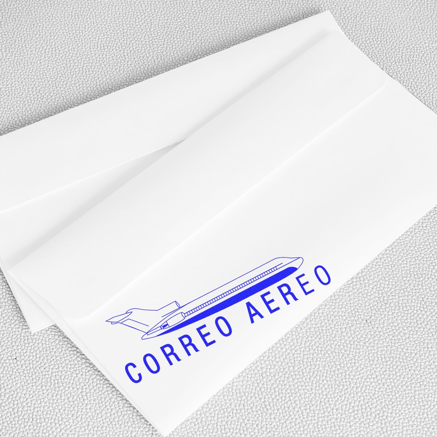 Air mail shipping envelope label marked Correo Areo with airplane icon on a white package background.