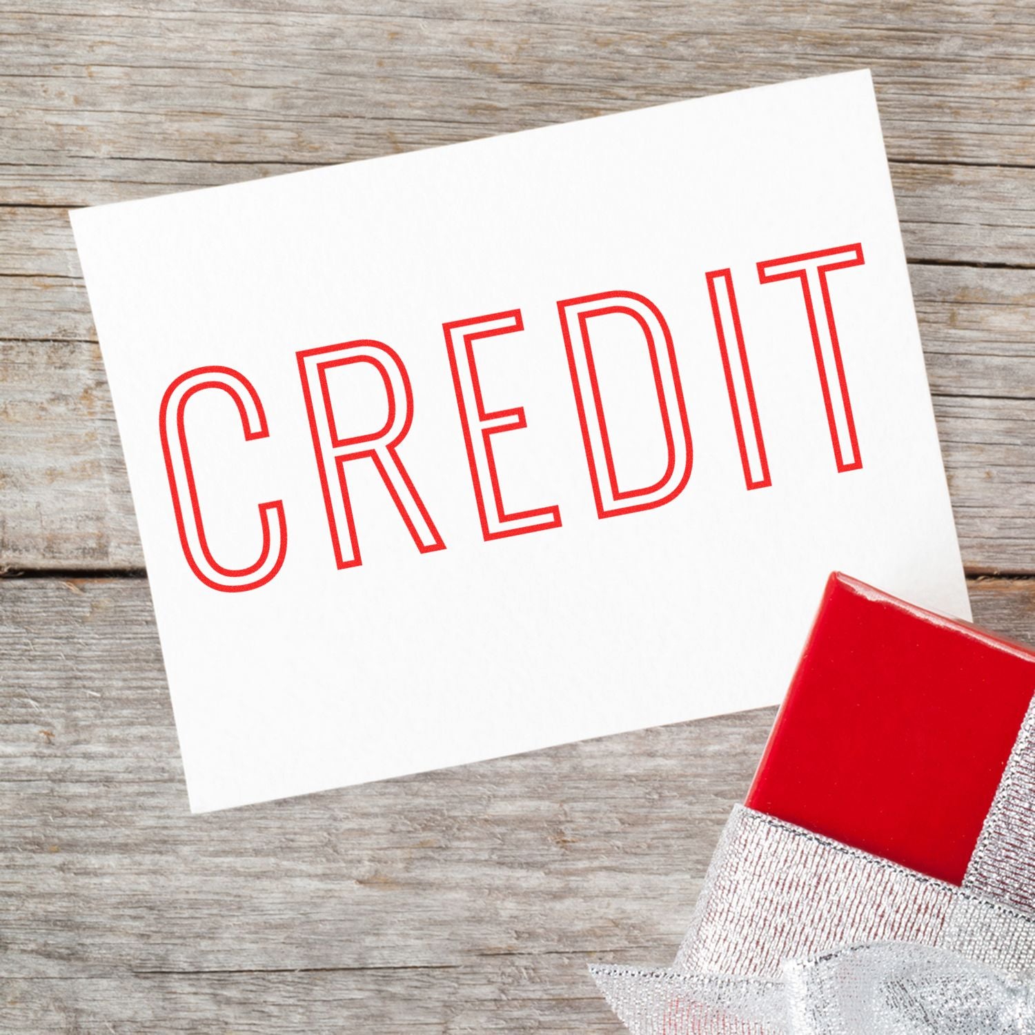 CREDIT concept card with red stamp on wooden background, illustrating credit approval for credit cards, financing, and payment options.