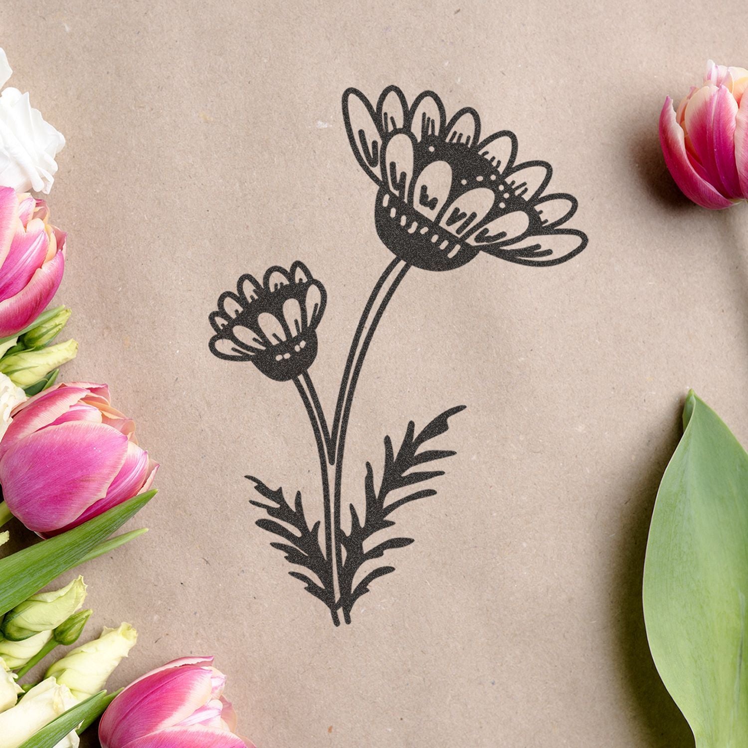 Minimal floral line art print on kraft paper surrounded by pink and white tulips, elegant botanical design
