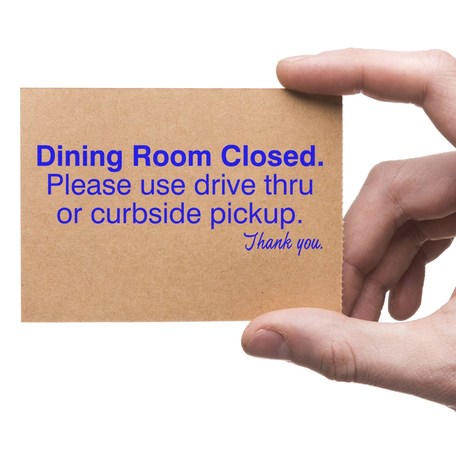 Hands holding a sign that says Dining Room Closed, Please use drive thru or curbside pickup for restaurant takeout and curbside service.