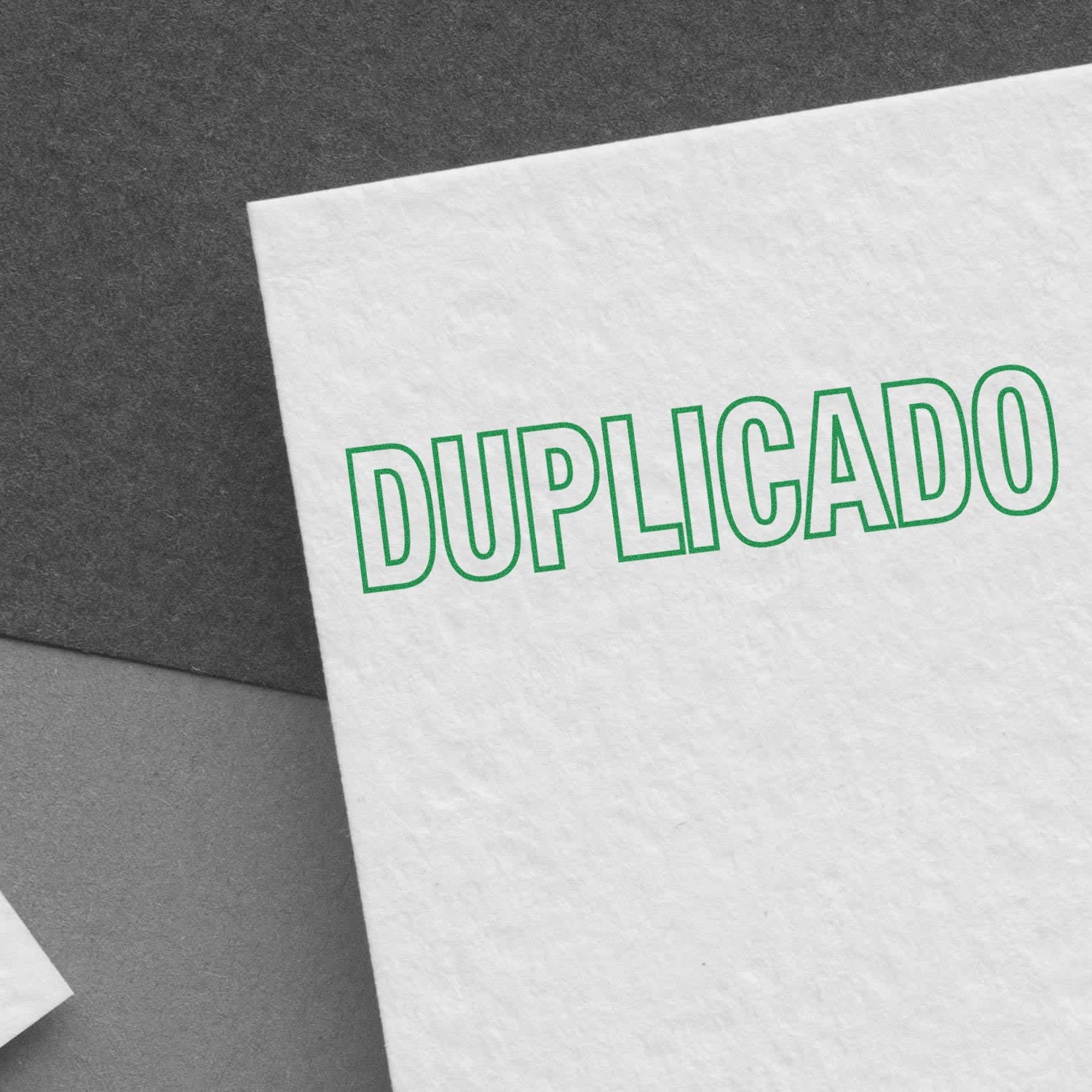 White printed card mockup with green DUPLICADO logo, showcasing custom branding for duplicate product labeling.