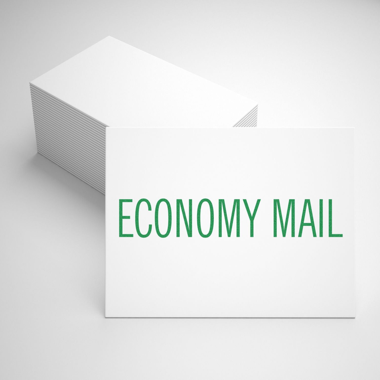 White economy mail envelopes stack with green ECONOMY MAIL text on a clean background.
