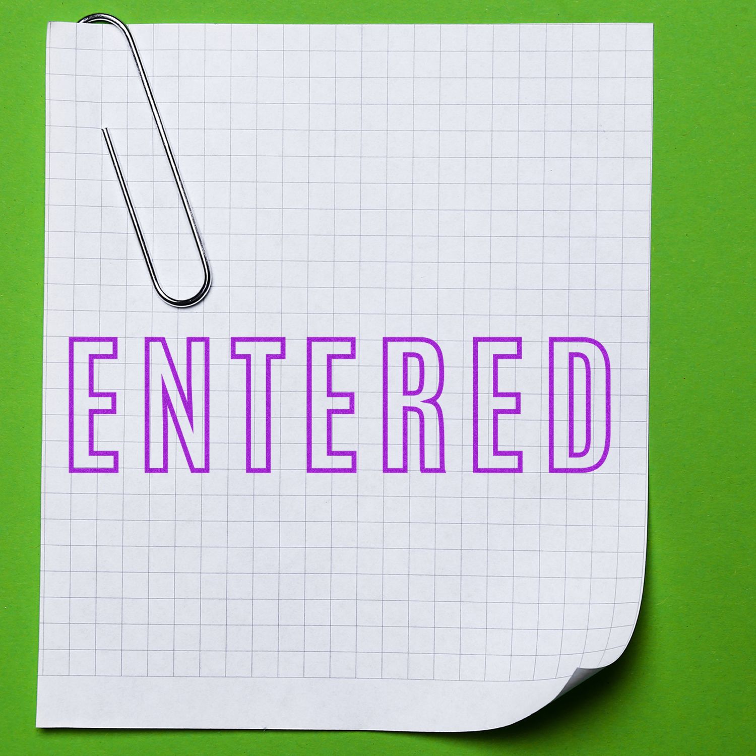 Notebook page with paperclip reading ENTERED, representing data entry status and confirmed form submission successfully online.