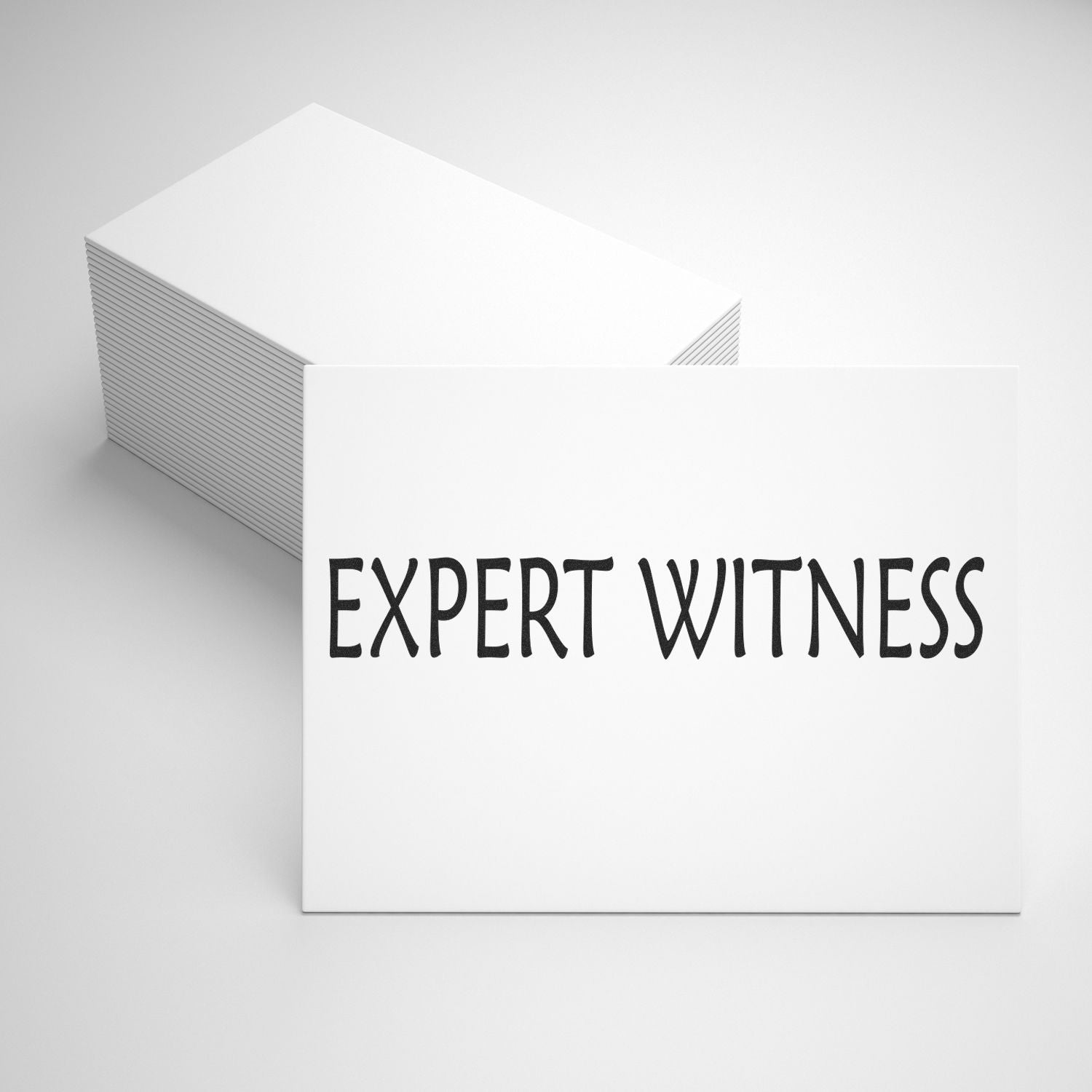 Stacked white cards showing EXPERT WITNESS text, highlighting professional legal expert testimony services.