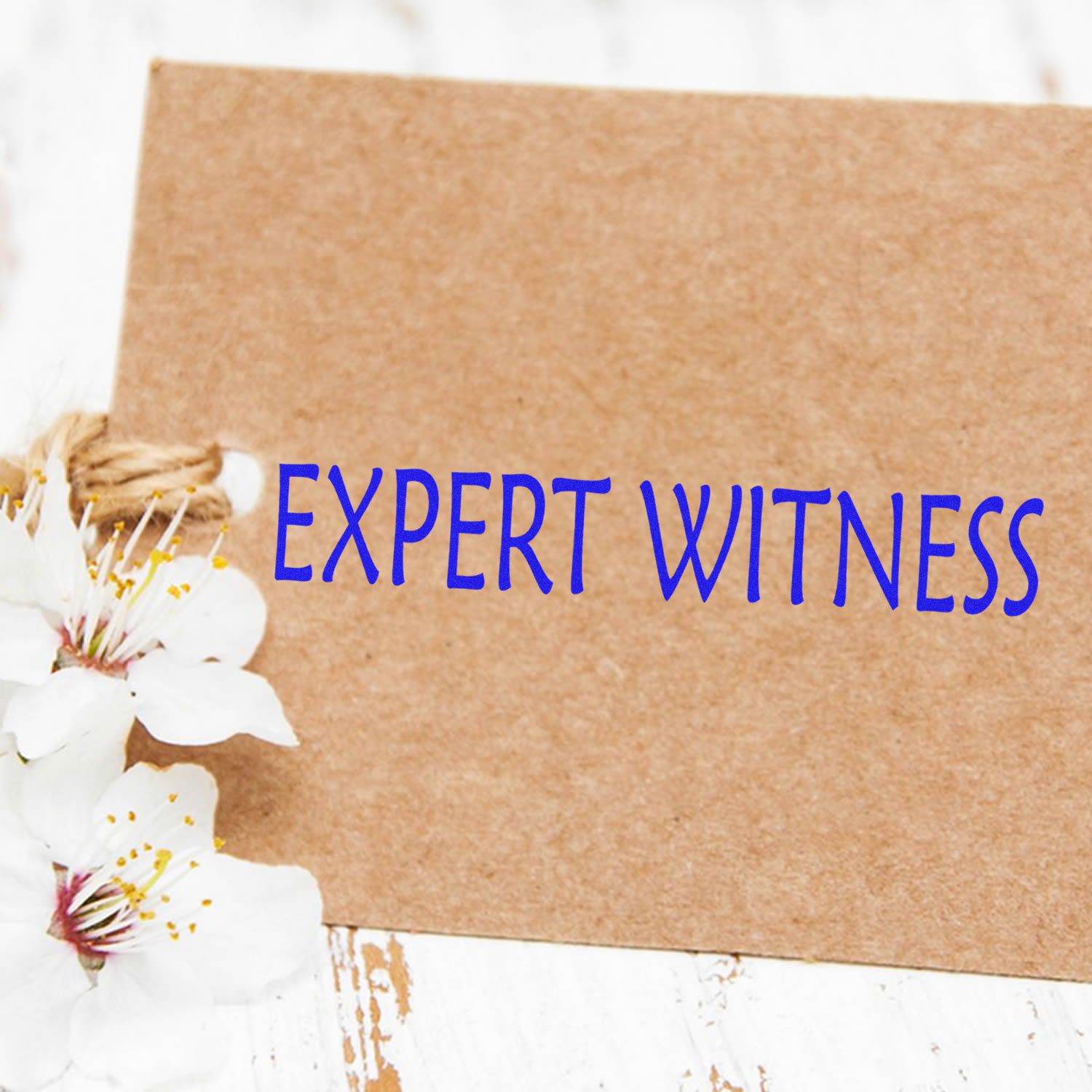 Expert witness services banner on kraft paper with white flowers, highlighting legal testimony expertise.
