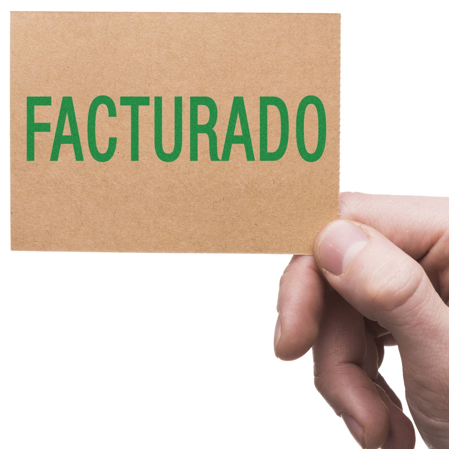 Hand holding kraft card with bold green text FACTURADO, indicating invoices have been issued and billed (invoiced status).