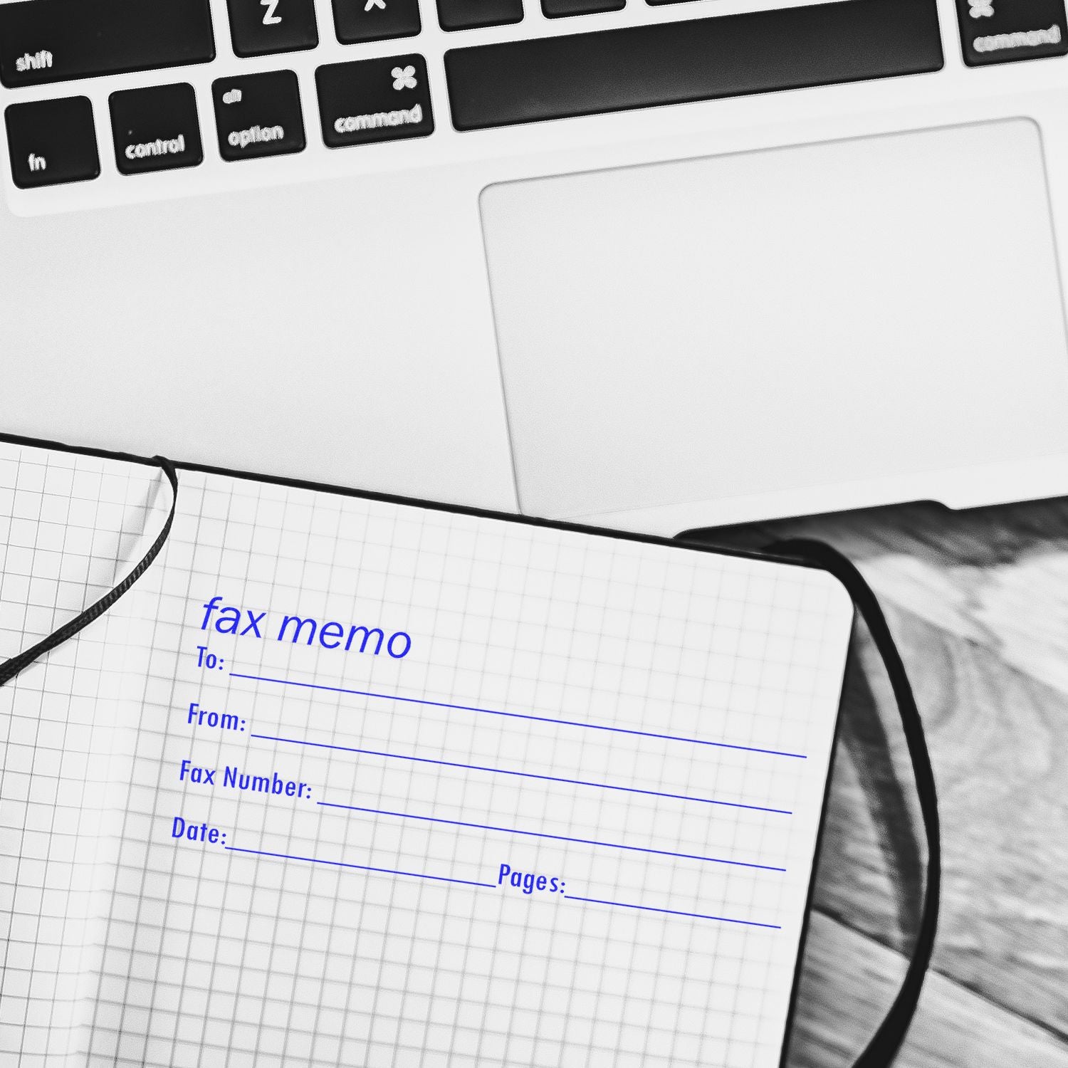Close-up of laptop keyboard with fax memo notepad, office communication concept, business stationery, and digital workspace.