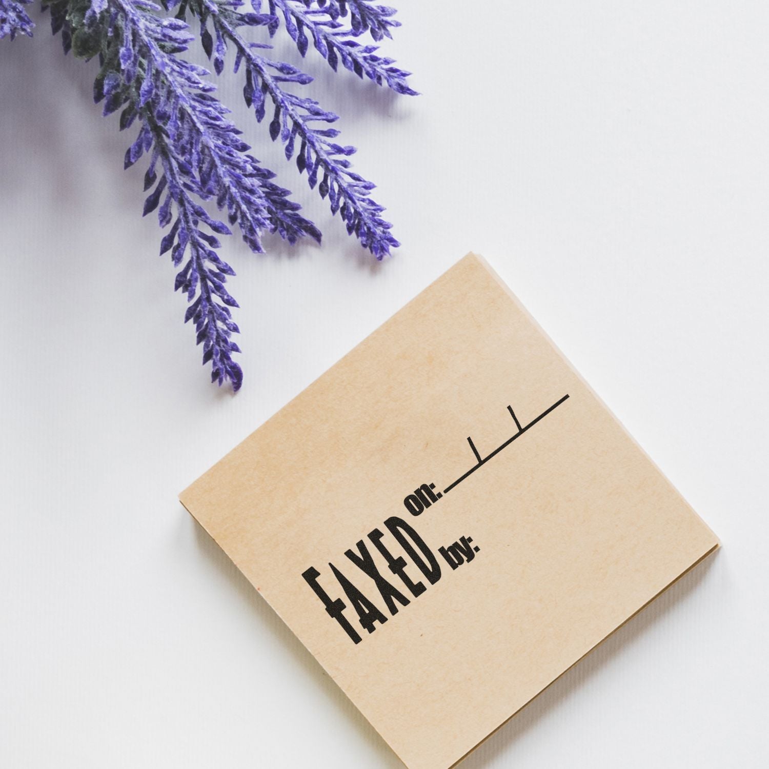 Minimalist tax-themed card reading taxed on: with purple lavender flowers on a white background.