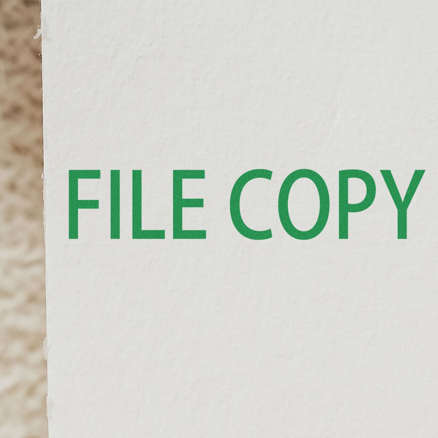 Green FILLER COPY branding text on a white wall, used for filler copy print or promotional signage.