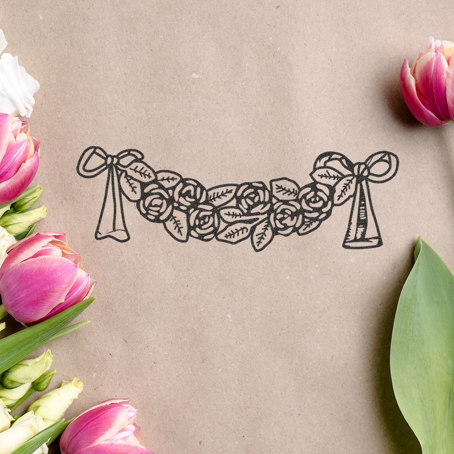 Elegant floral wedding illustration on kraft paper with pink tulips framing a decorative black bouquet design.