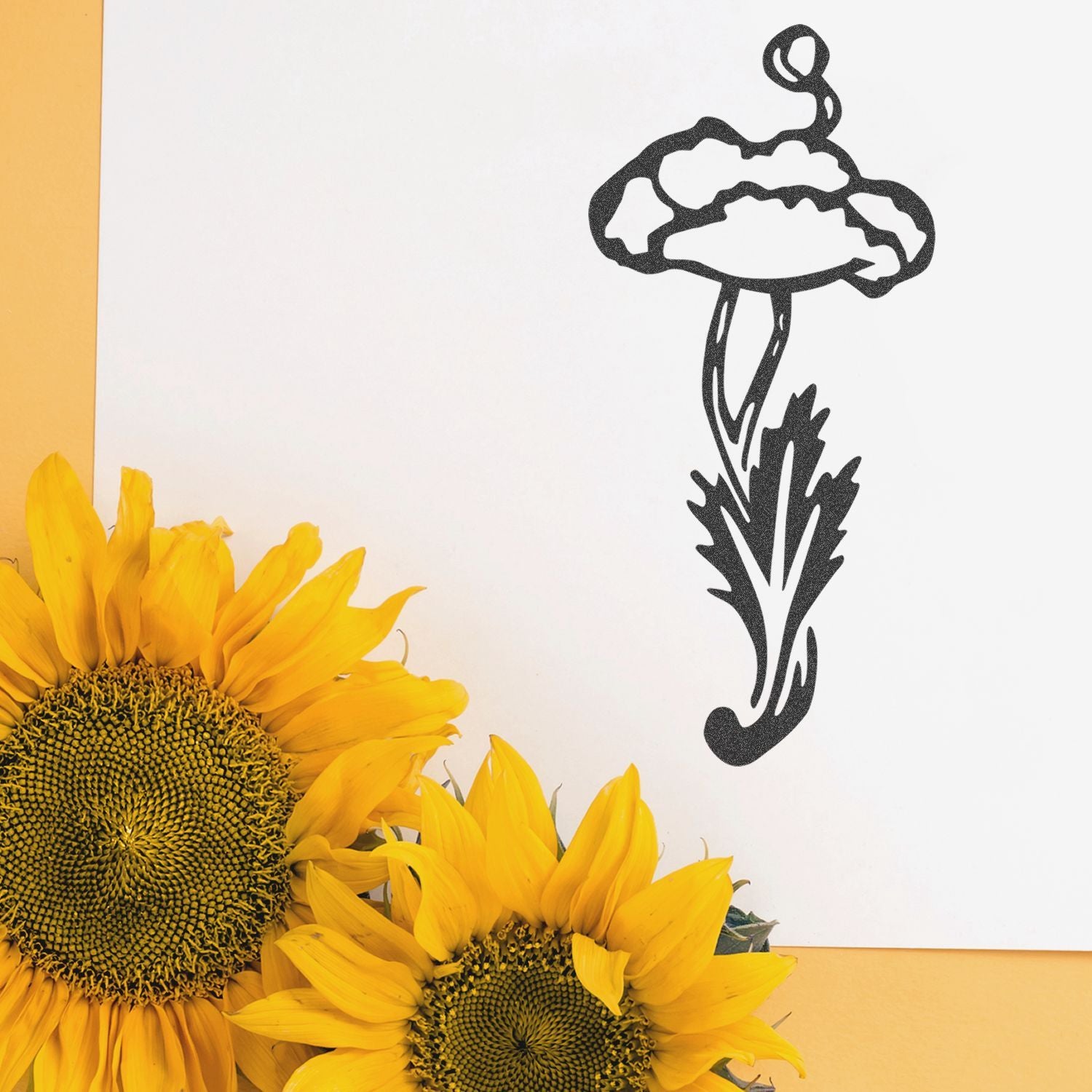 Bright sunflower bouquet with black floral stencil art on white paper, modern botanical decor on a yellow background.
