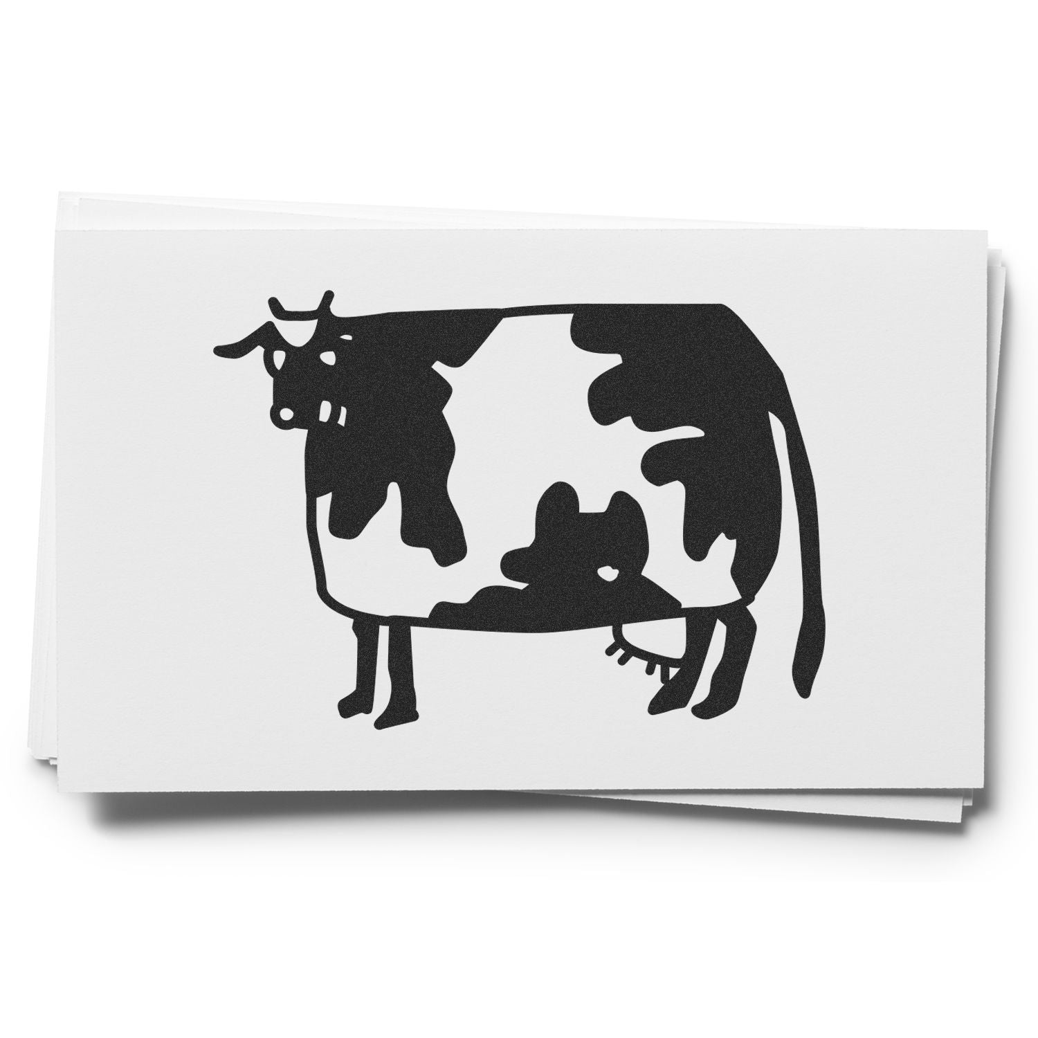 Black cow silhouette logo on white business cards stack.