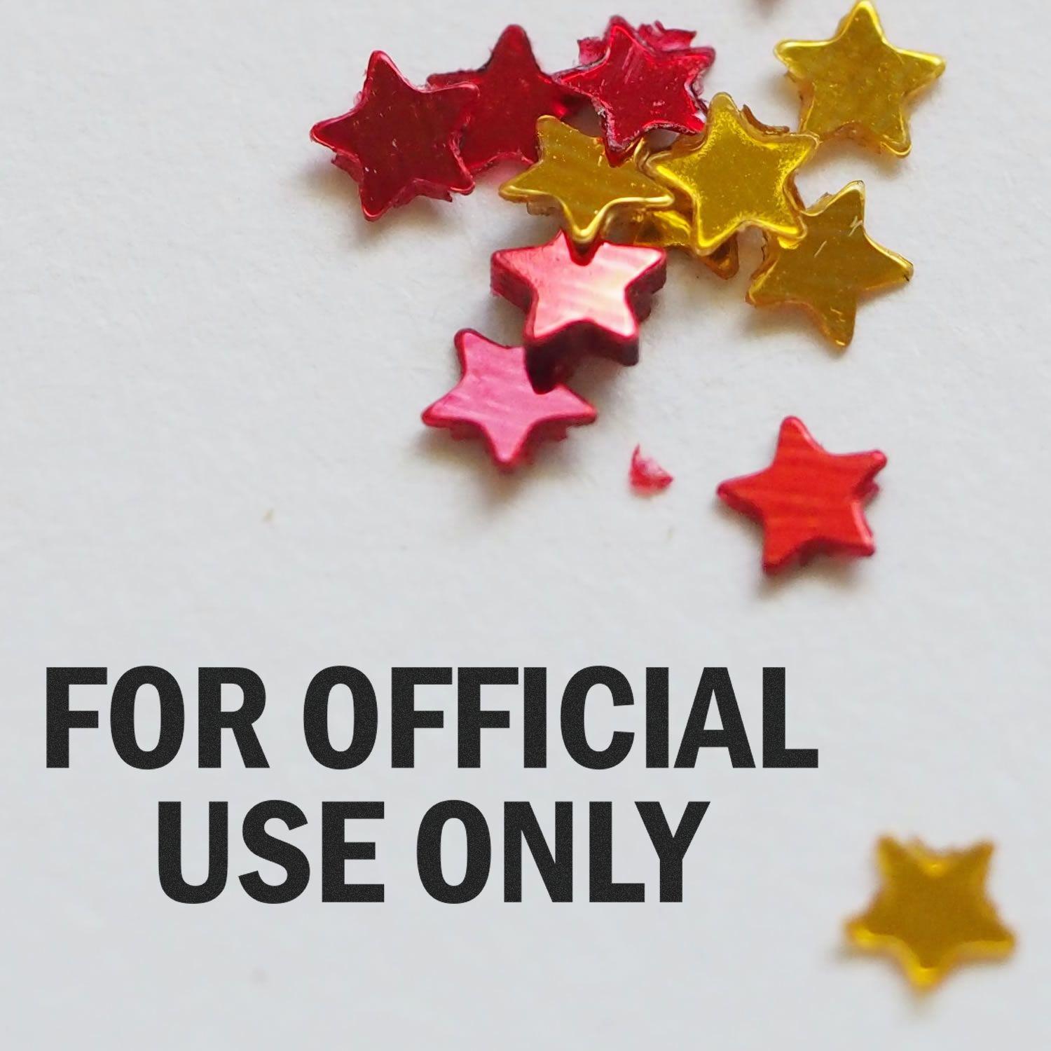 Red and gold star confetti on white background with For Official Use Only text overlay.