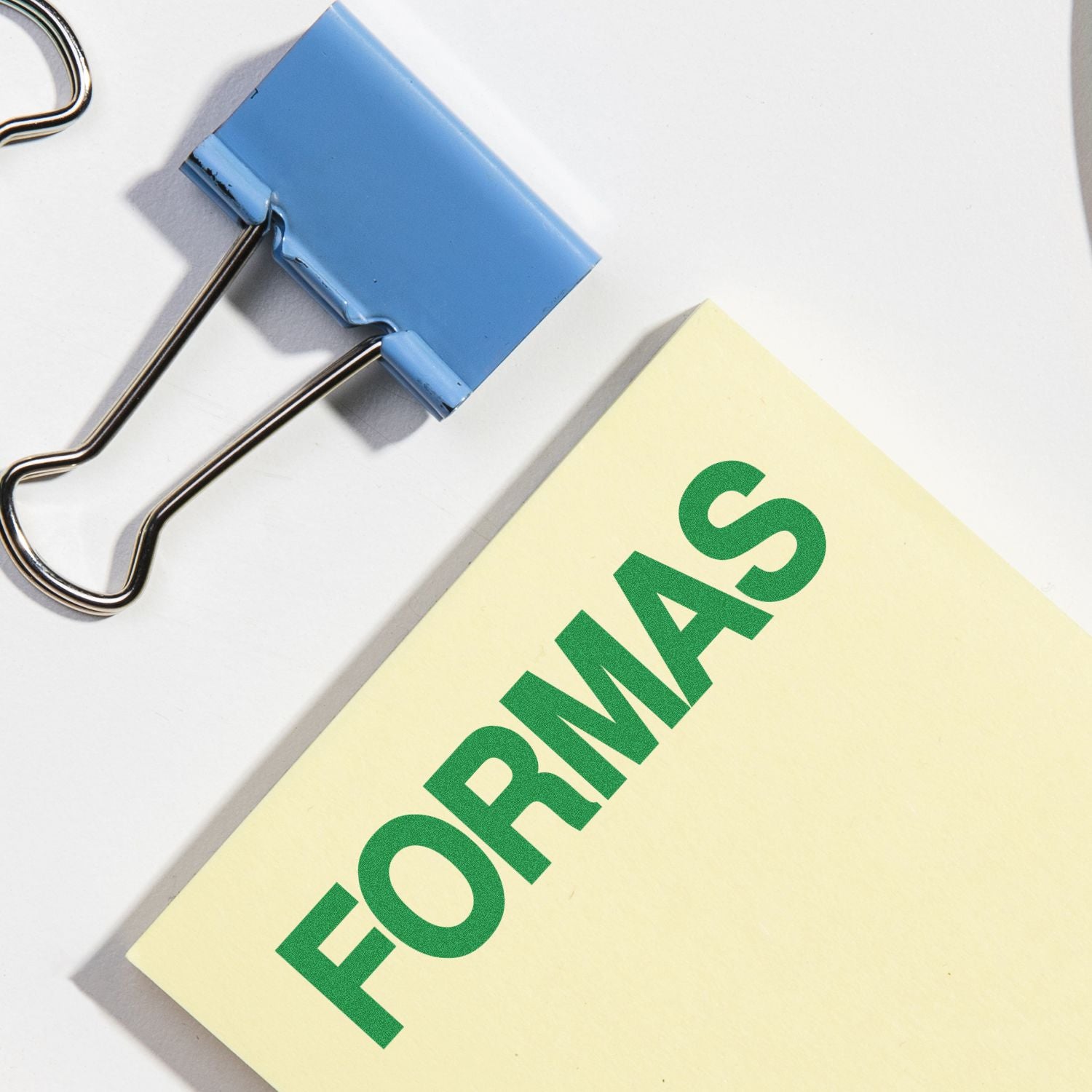 Binder clips secure a yellow Forward document, showing business document organization and secure file handling for teams workflows.