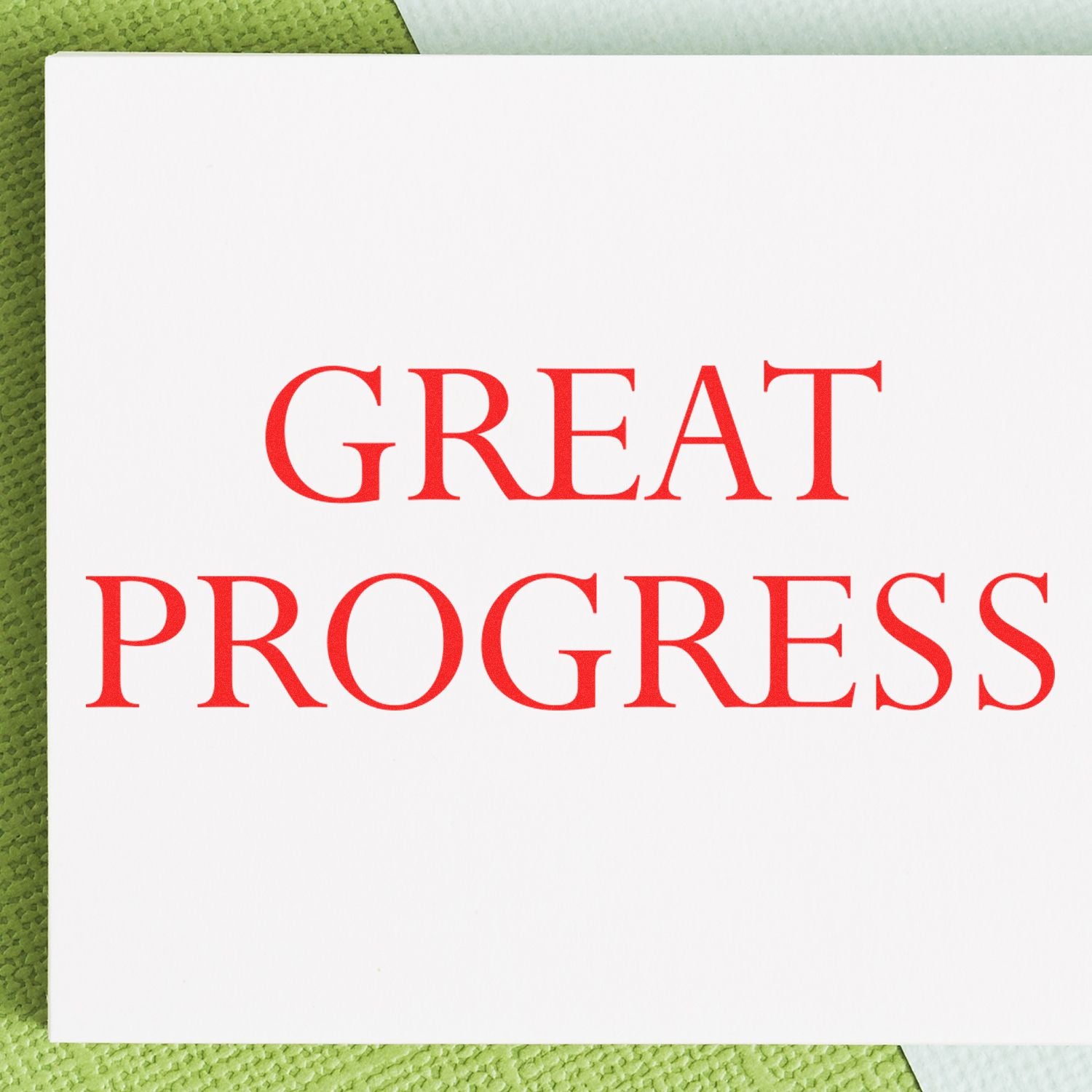 Motivational poster reading Great Progress in red letters on a white page for achievement, goal setting, over green textured background