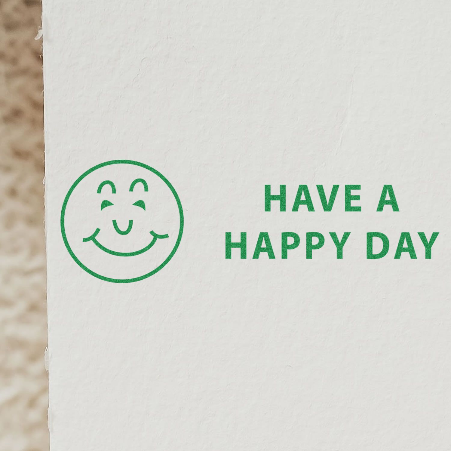 Green smiley face icon with Have a Happy Day text on white background.