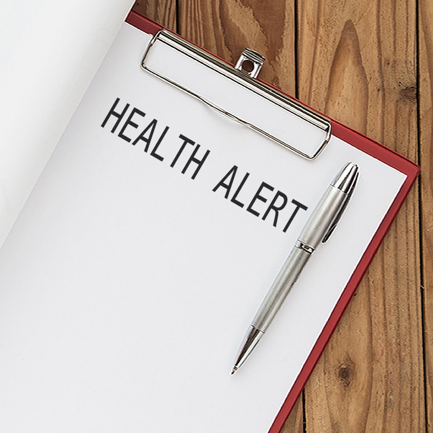 Health alert document with pen and clipboard, highlighting medical notifications and emergency preparedness for healthcare and safety.