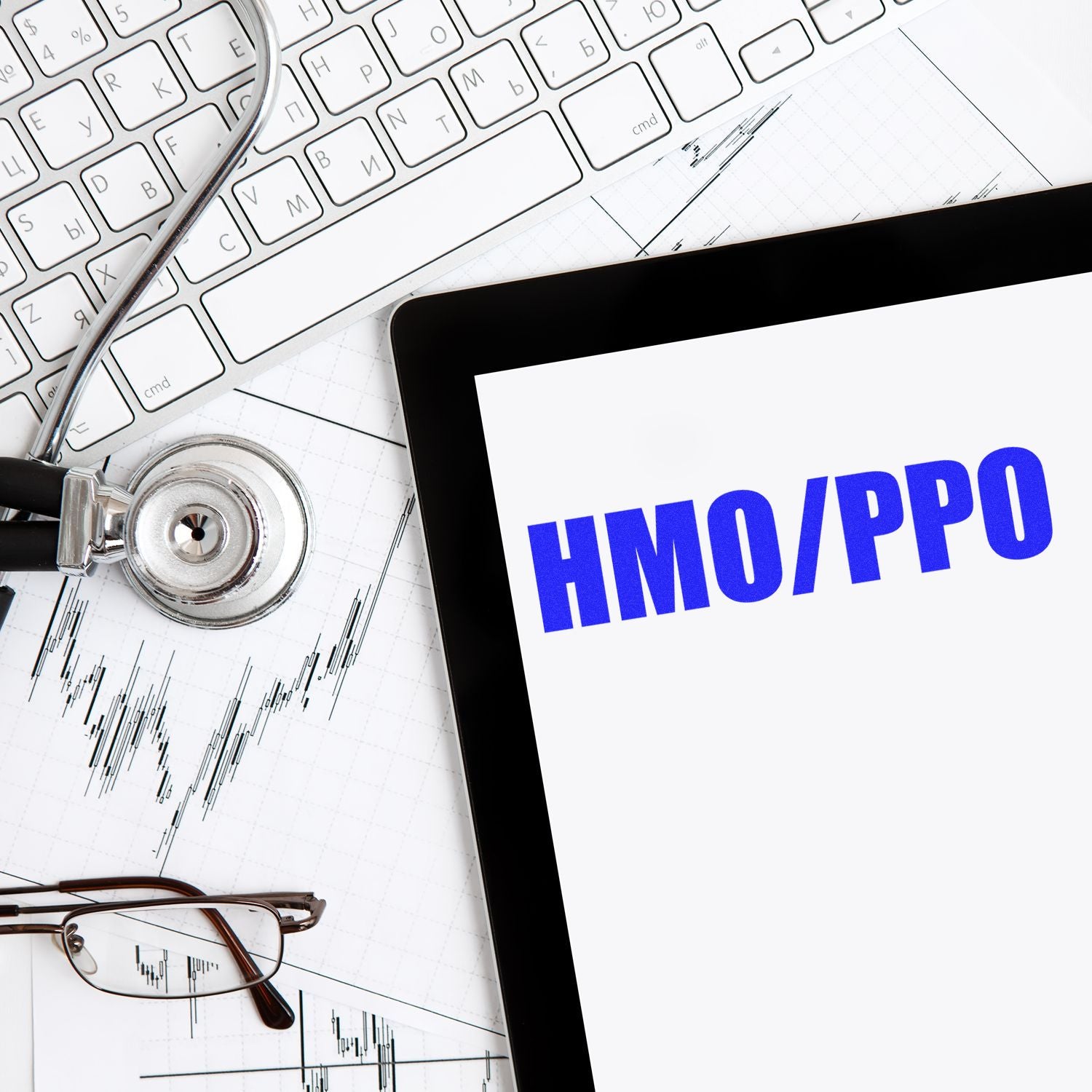 Health insurance HMO PPO plan comparison showing healthcare coverage tools with stethoscope, medical charts, and laptop financial data.