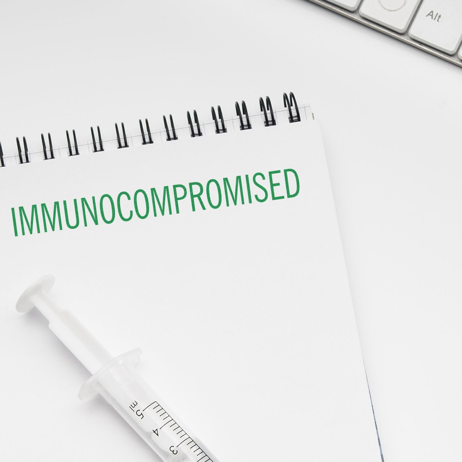 Medical concept for an immunocompromised patientsyringe and healthcare document emphasizing immune system vulnerability