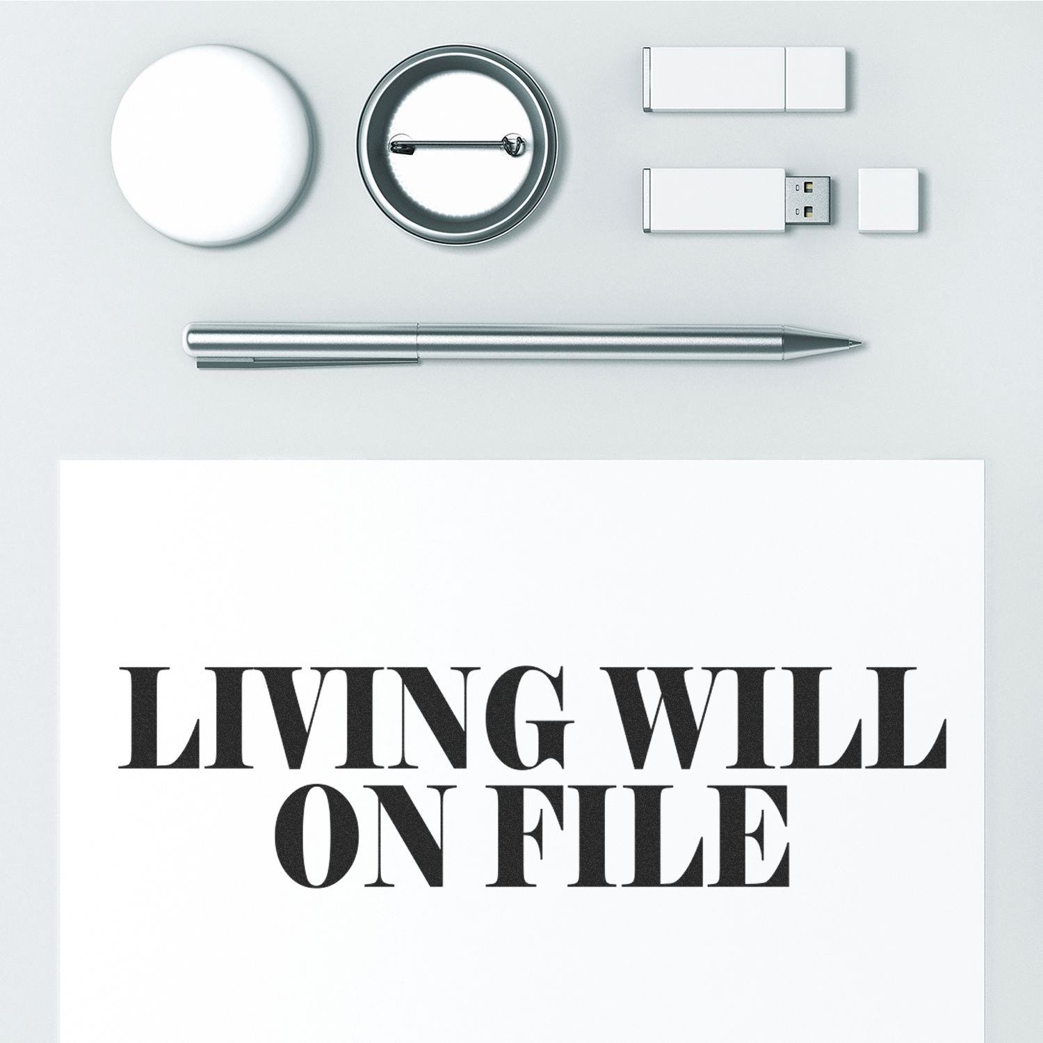 Minimalist legal concept image with magnifying glass, USB drive, and pen reading Living Will on File.
