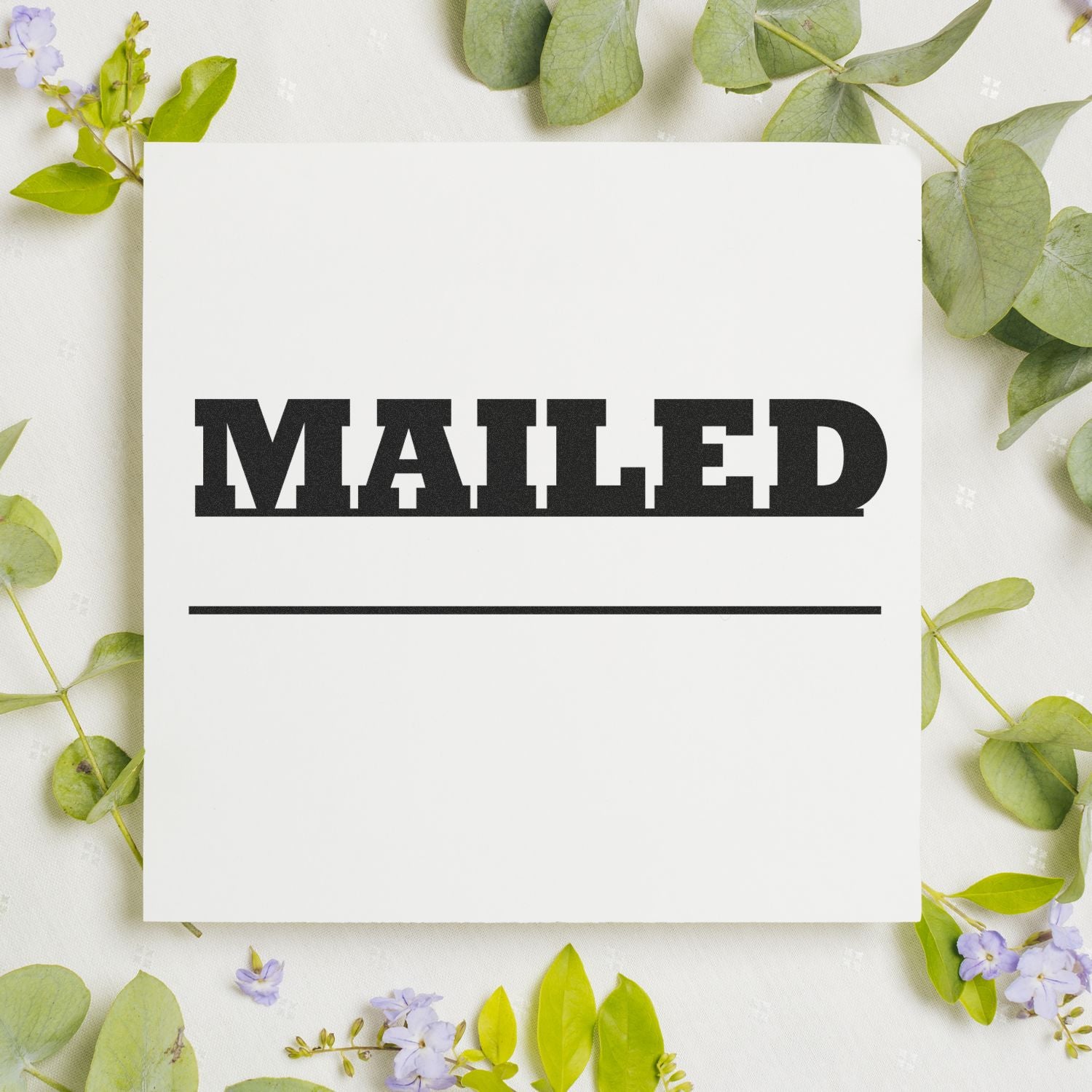 Botanical stationery card reading MAILED on white background with green leavesfree printable mailing announcement template.