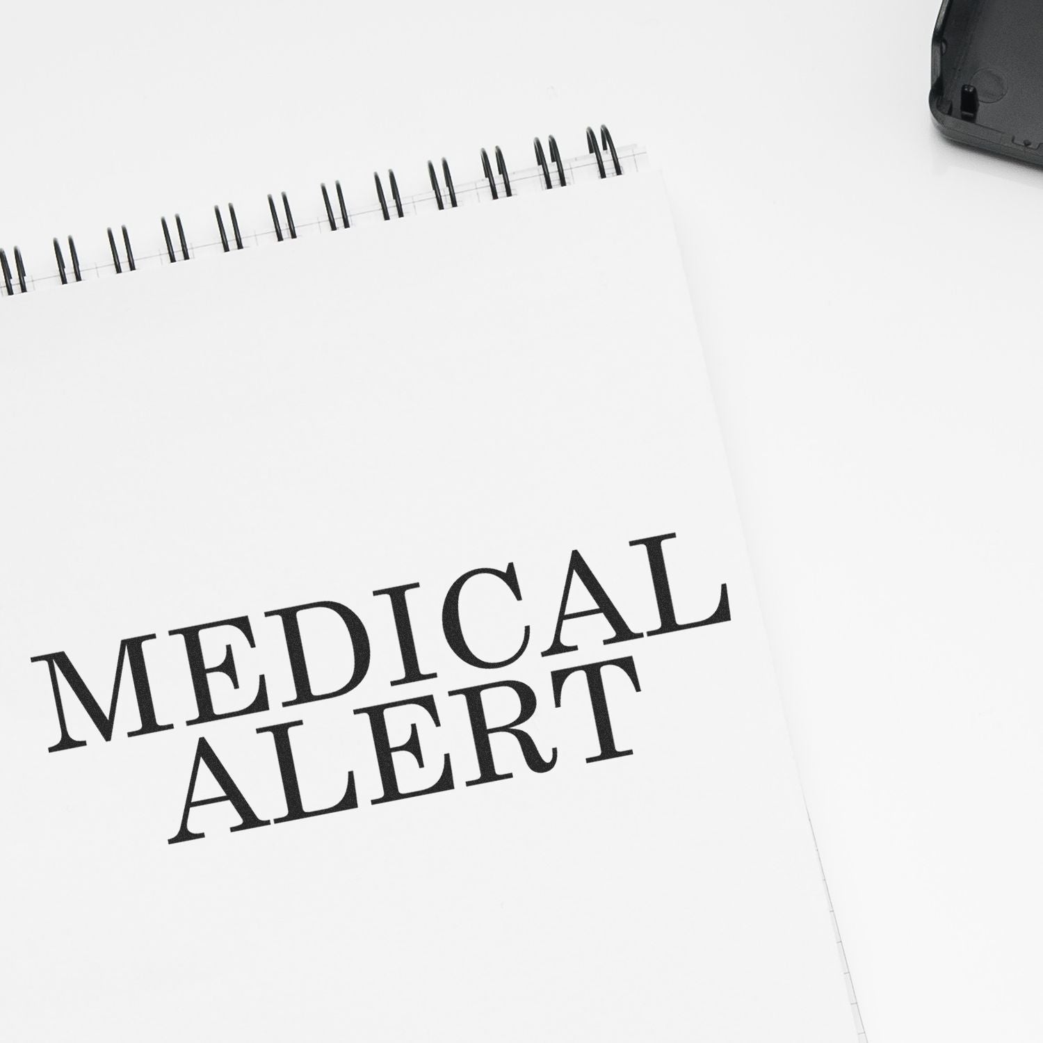 Medical alert notebook page with bold text and spiral binding, highlighting emergency healthcare information.