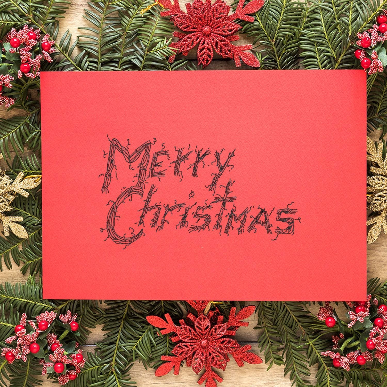 Red Merry Christmas card with festive pine greenery, red ornaments, and glitter snowflake holiday decorations.