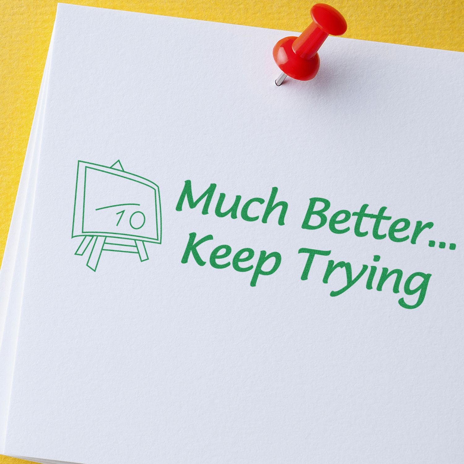 Motivational message Much Better, Keep Trying pinned with a red pushpin, encouraging perseverance and self-improvement.