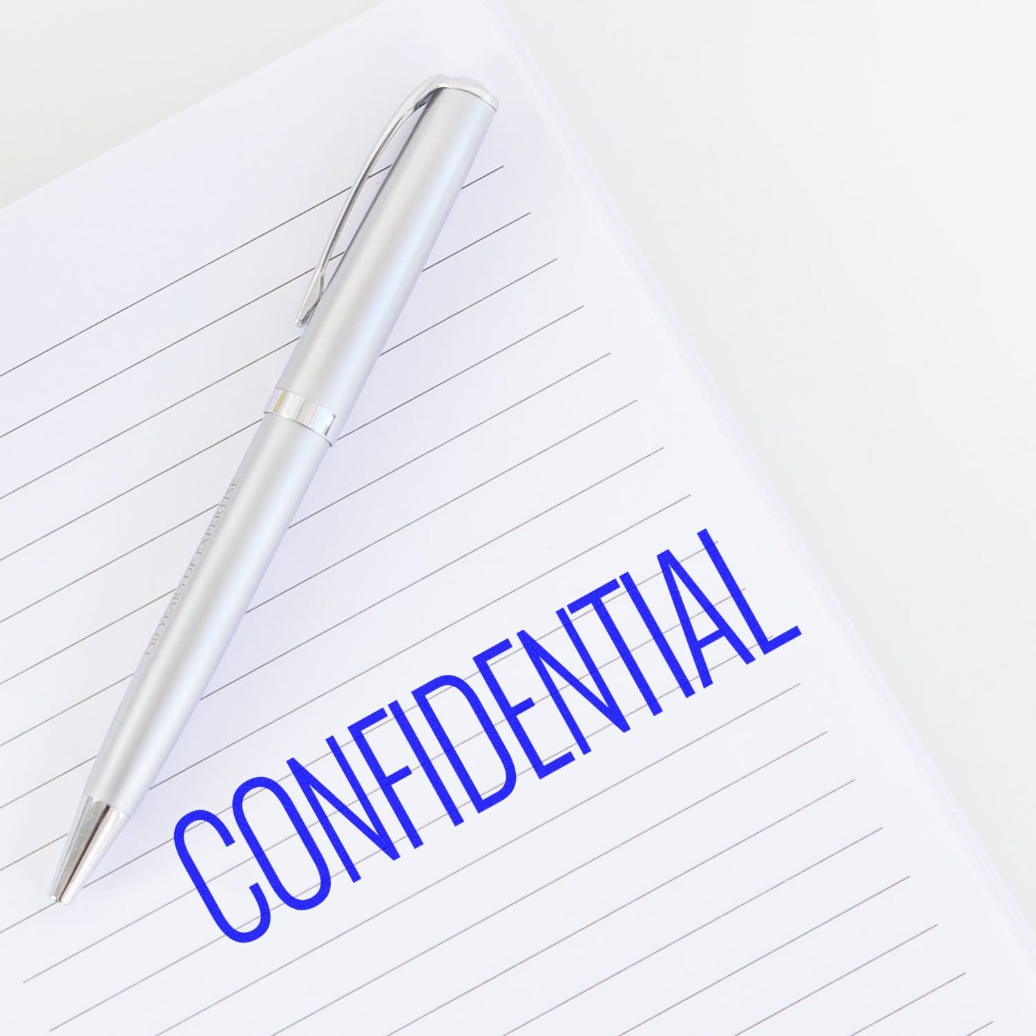Pen on lined notebook showing CONSULTANT, illustrating professional consulting services for business strategy and planning.