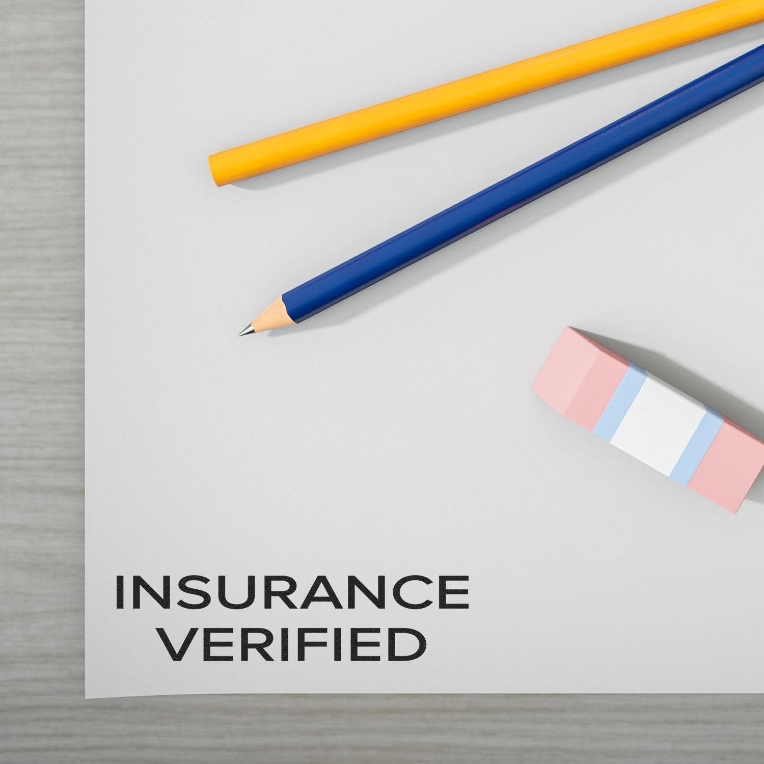 Insurance Verified concept image showing pencils on paper with Insurance Verified text for policy confirmation