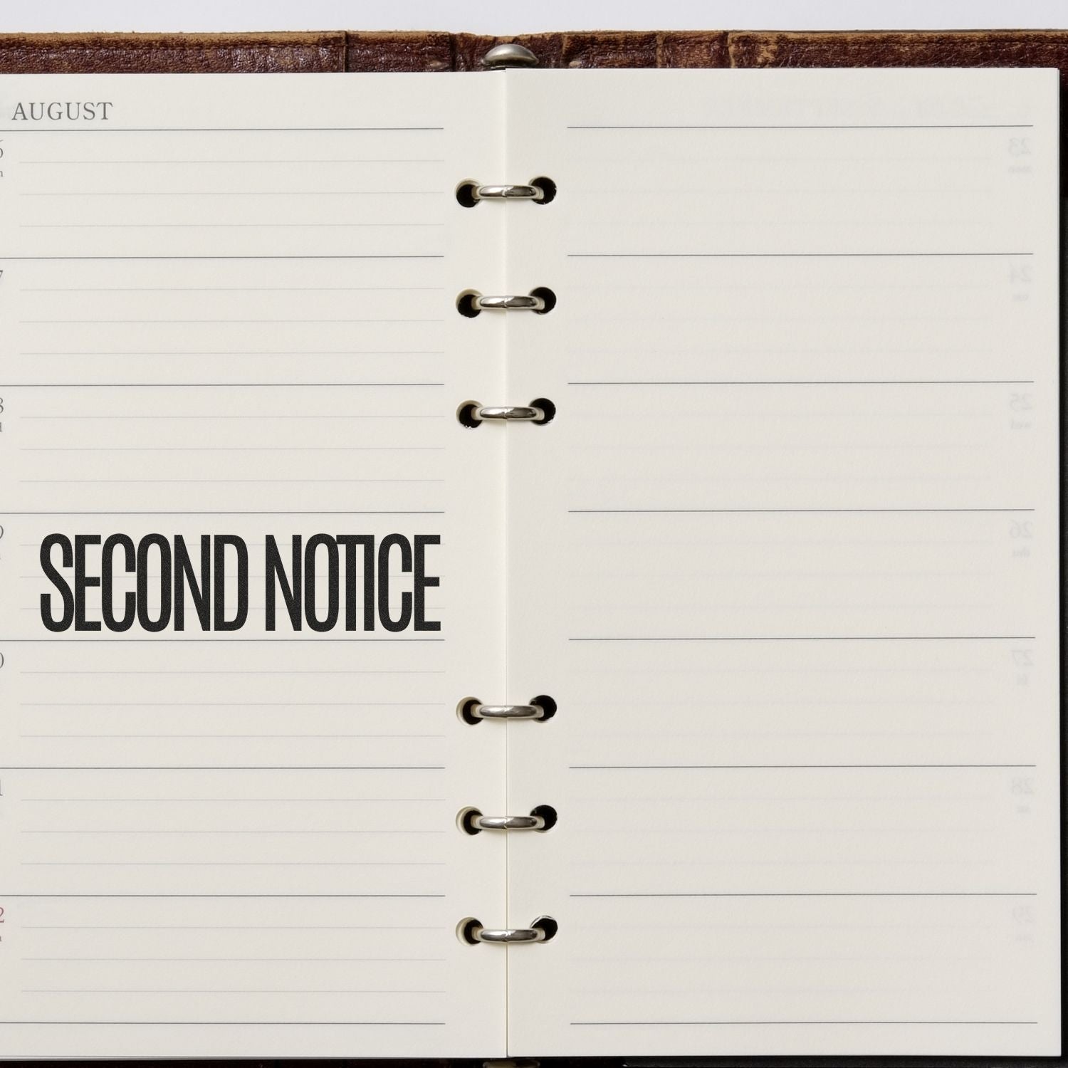 Open August planner page labeled Second Notice with lined space and binder rings, suggesting a follow-up reminder for security alerts.
