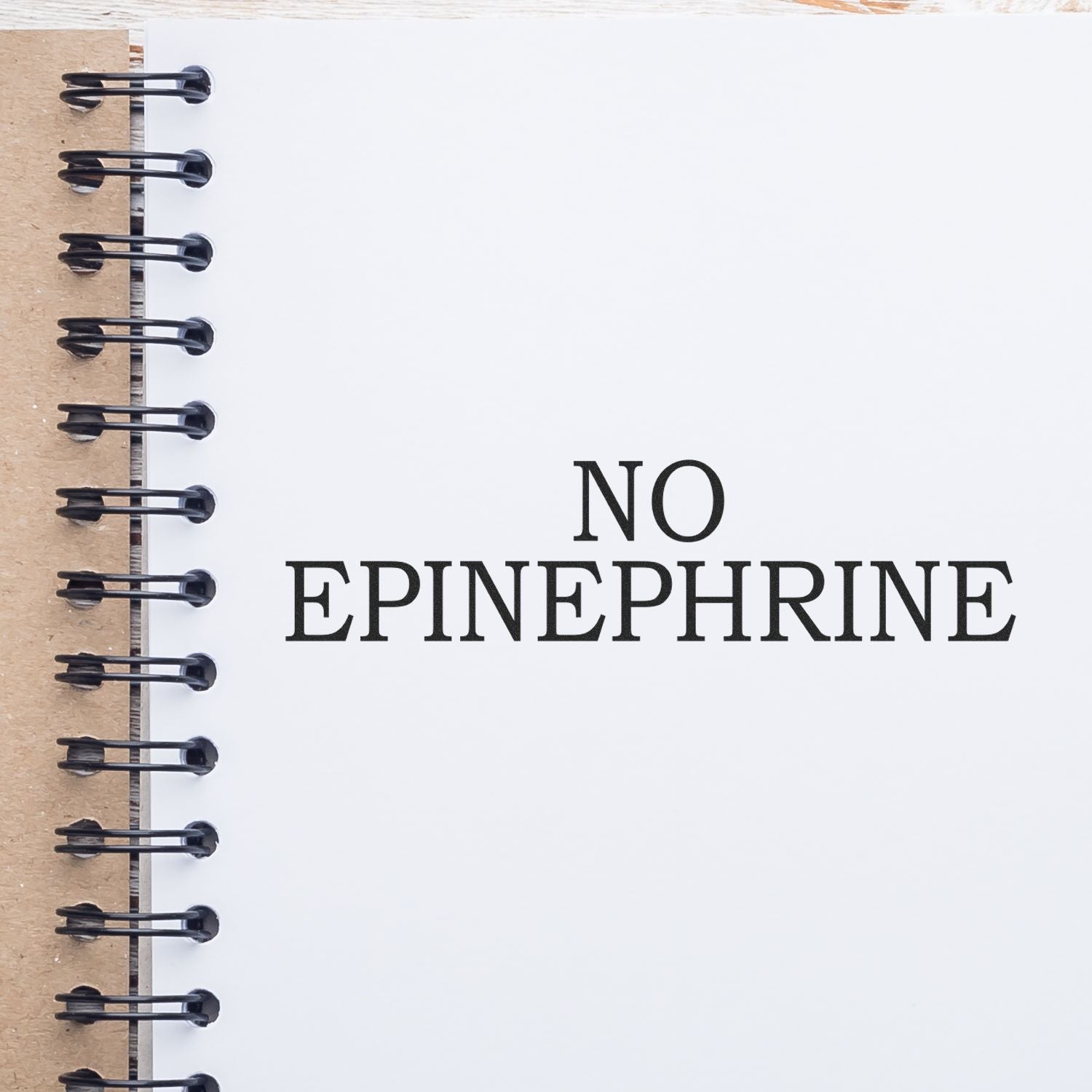 Notebook cover with bold NO EPINEPHRINE text, warning against using epinephrine in medical treatment.