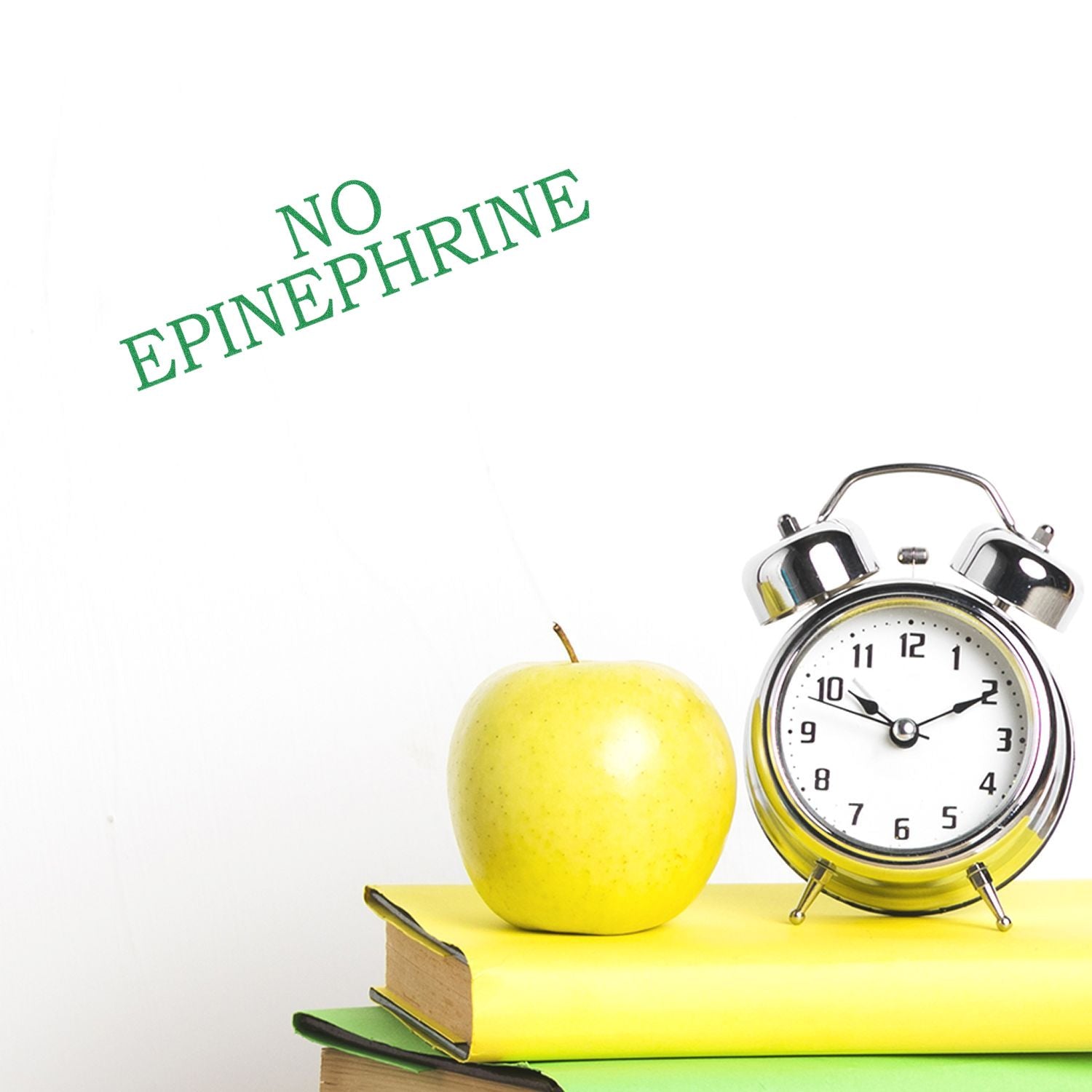 No expiry stamp over alarm clock and apple on books, promoting long-lasting food freshness and extended shelf life