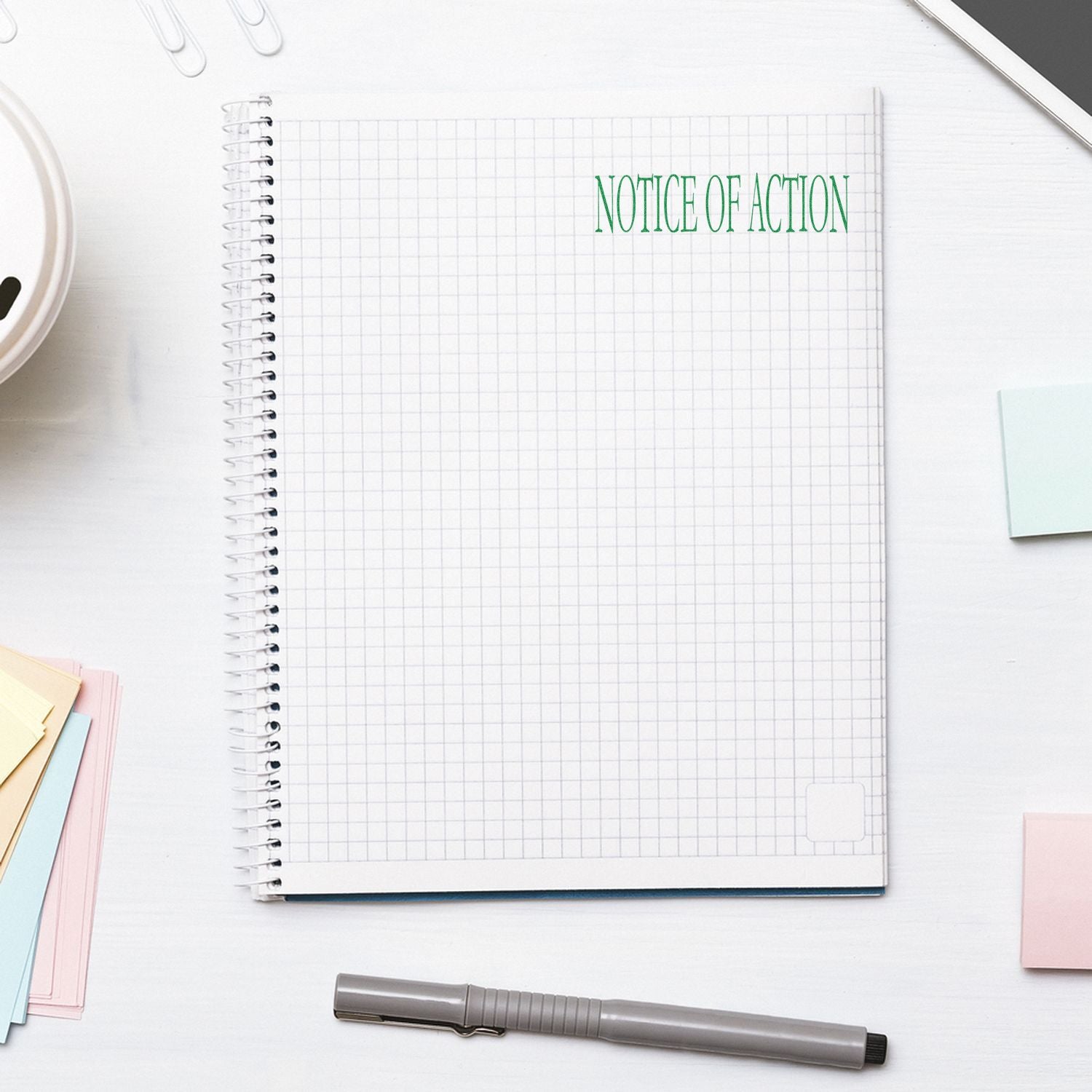 Blank legal notice of action on grid notebook page with stationery, highlighting an official court or legal filing announcement.
