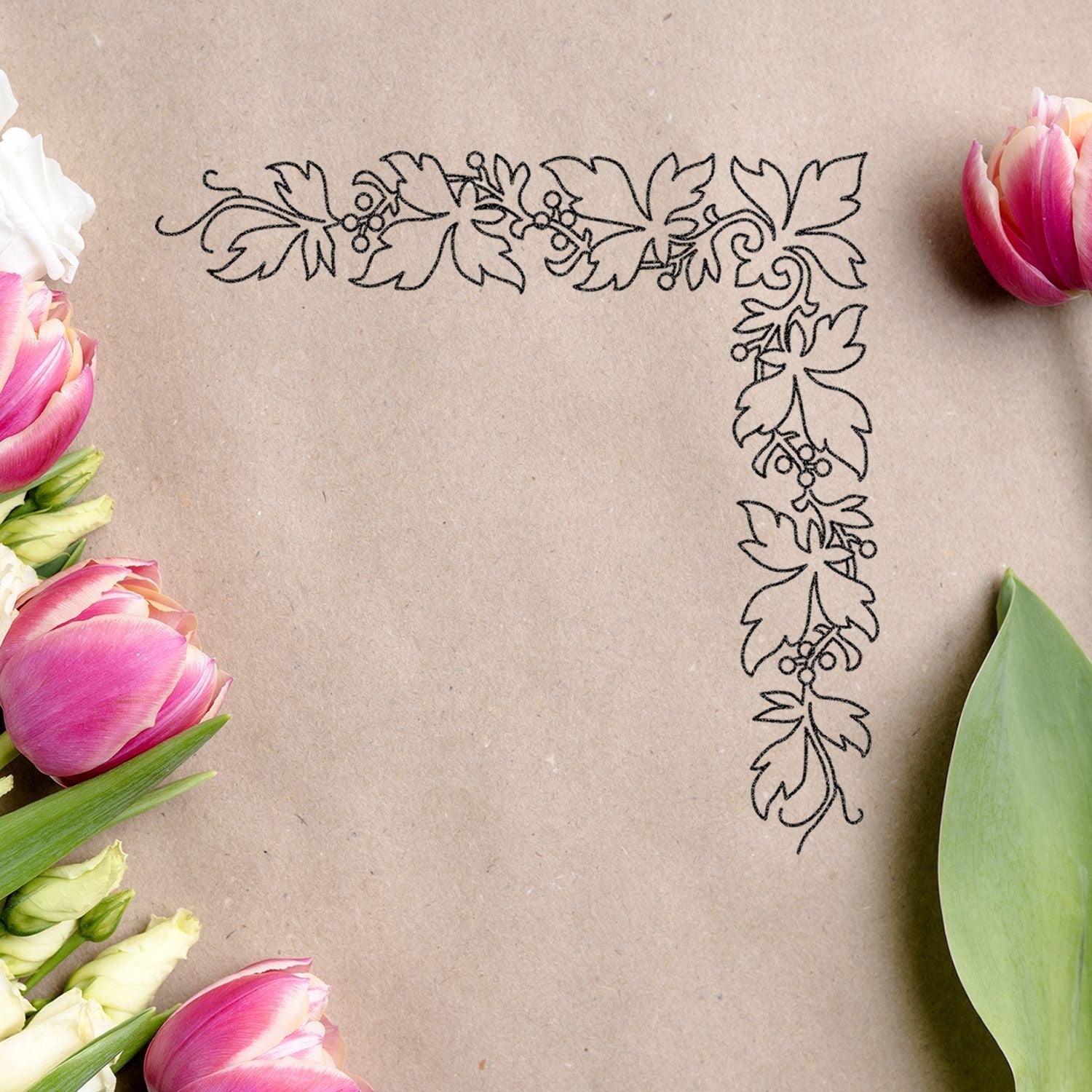 Floral corner border with pink tulips on kraft paper background, elegant botanical design template.