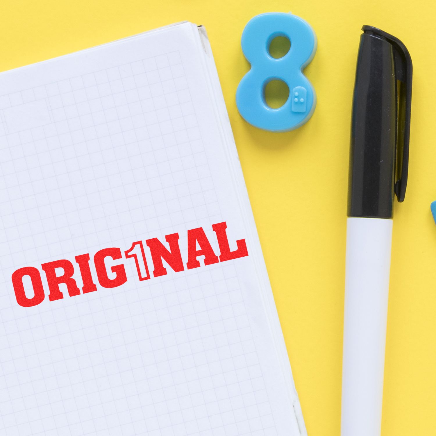 Original notebook page with red ORIGINAL title, black pen and blue eraser on yellow study desk background.