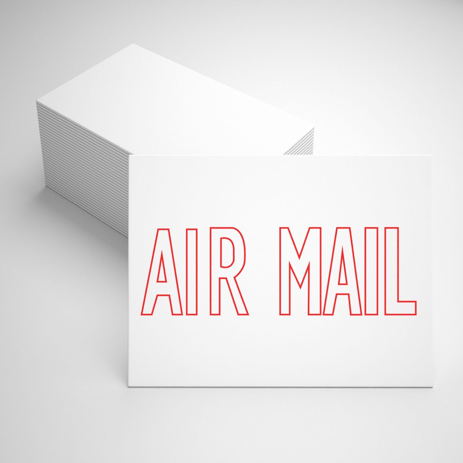 Stack of white business cards with red AIR MAIL text, minimalist stationery design on a clean white background.