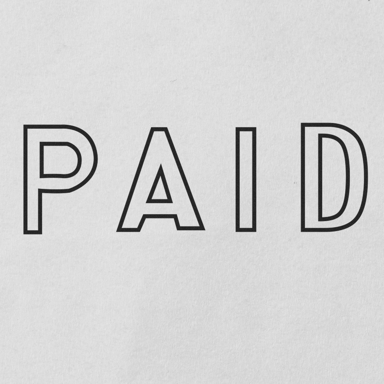 PAID stamp typography for invoices and receipts, bold black letters on light background indicating payment confirmed.
