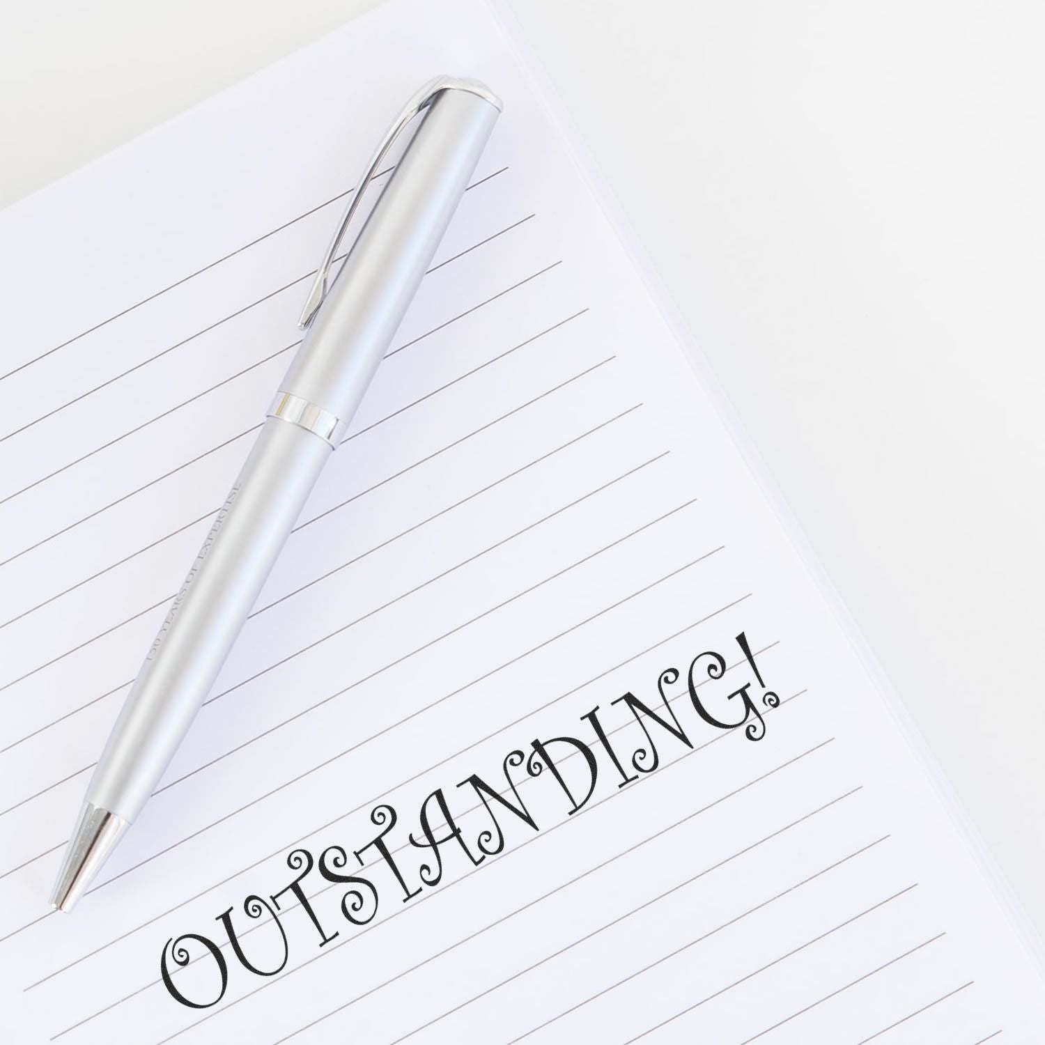 White pen on lined notebook paper, conveying everyday writing, journaling, and note-taking for an organized lifestyle at home or work.