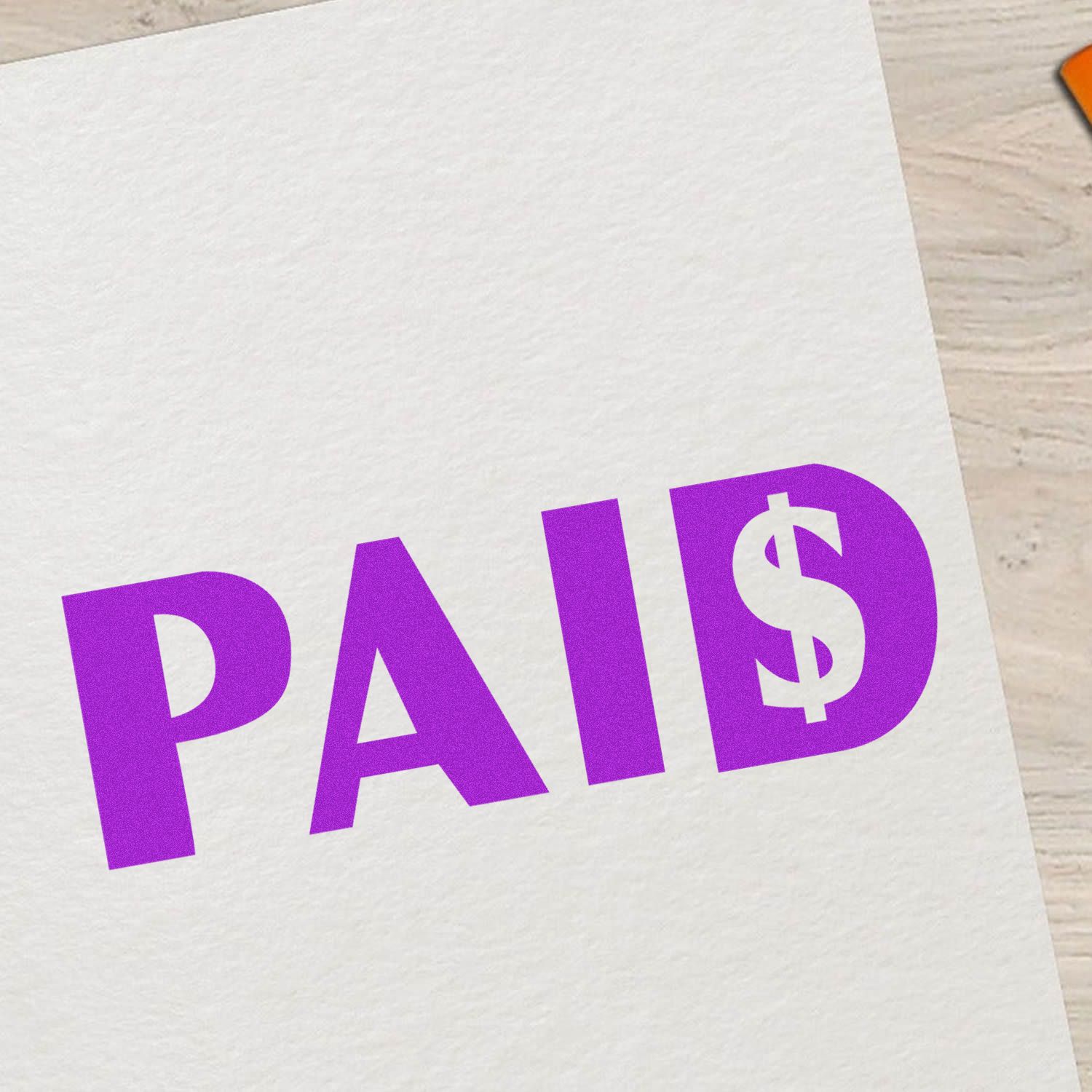 Purple PAID stamp with dollar sign on white paper, indicating payment received and account settled.