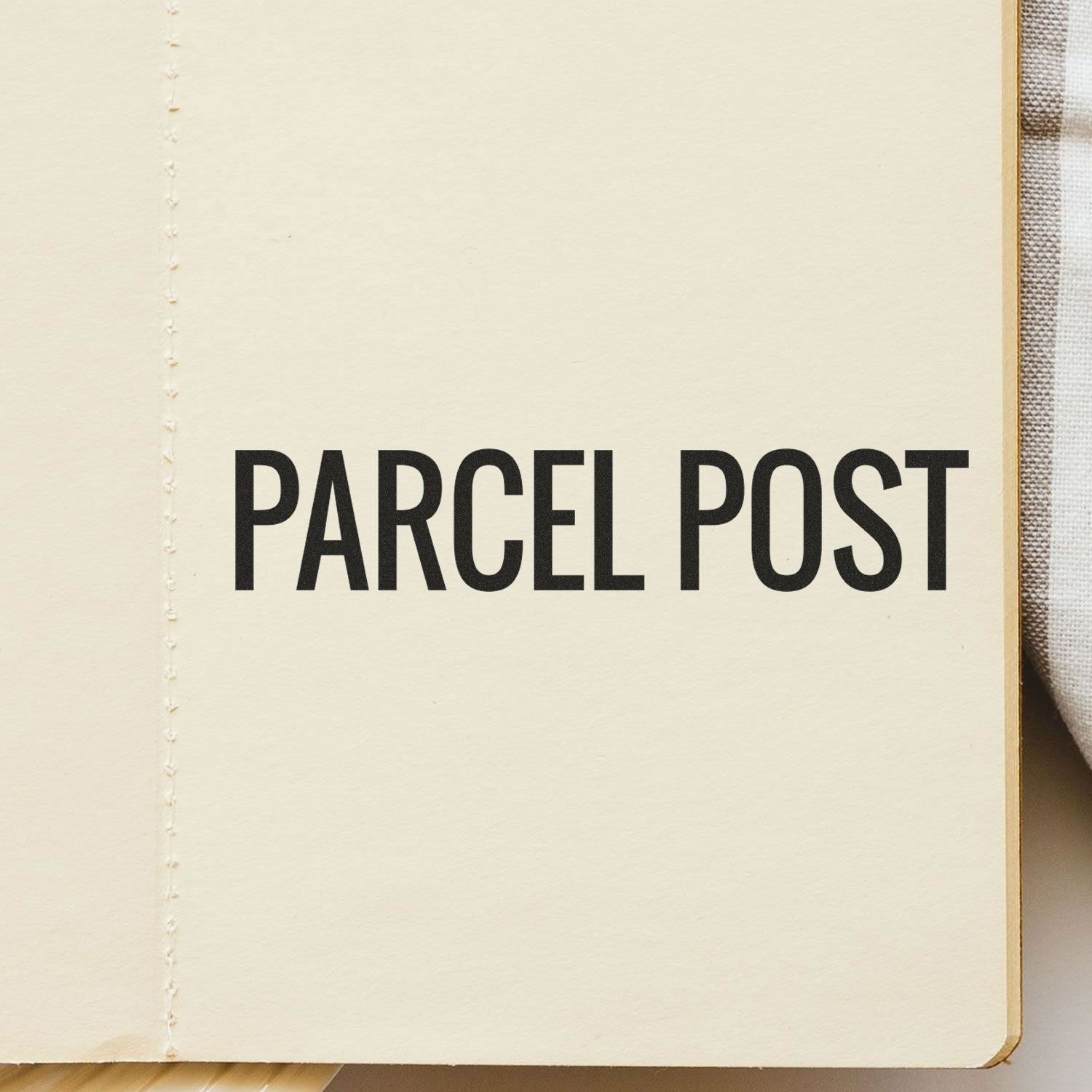 Close-up of book page titled Parcel Post, referencing mail shipping services and postal delivery history