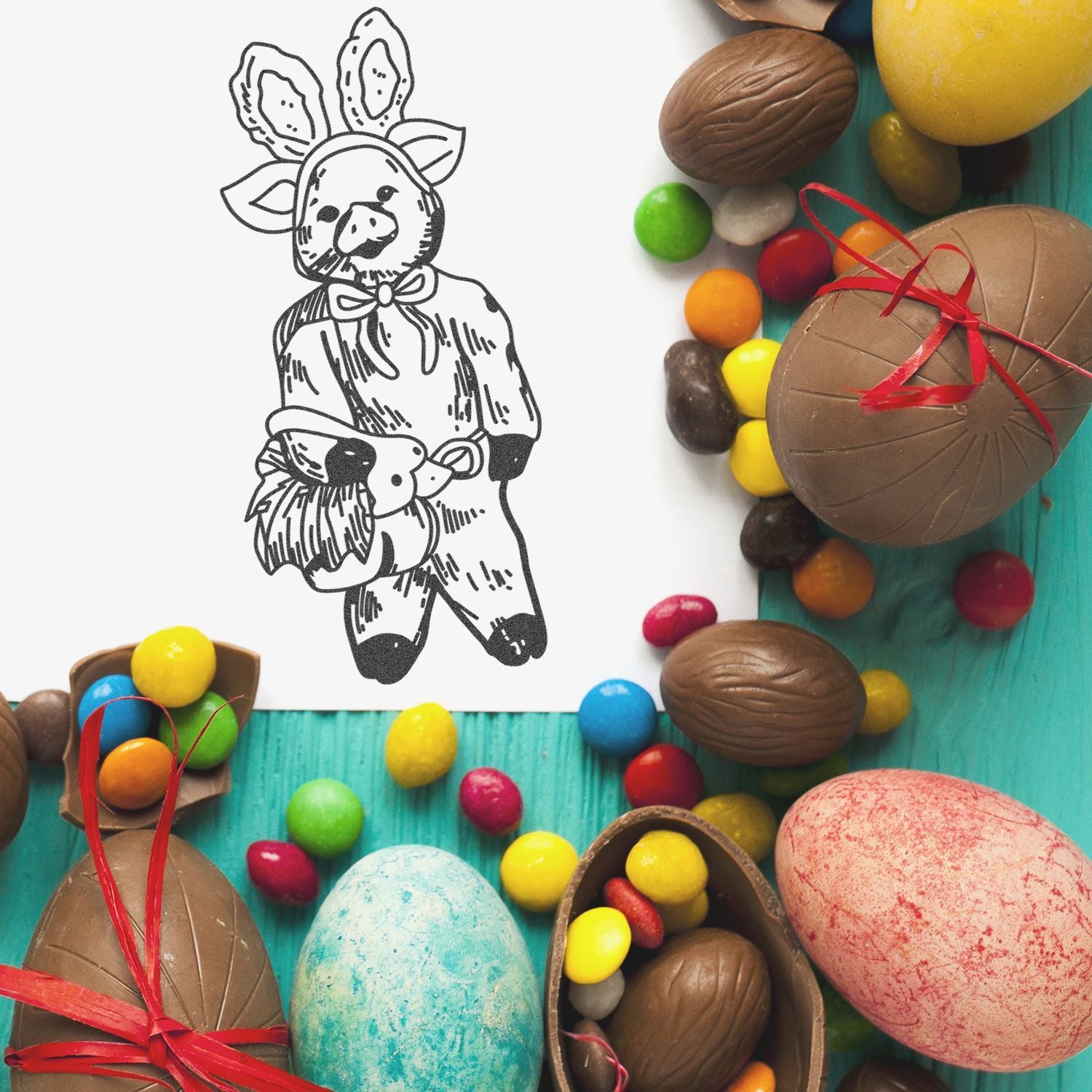 Easter chocolate eggs and colorful candy surrounding a cute hand-drawn bunny illustration on a turquoise background