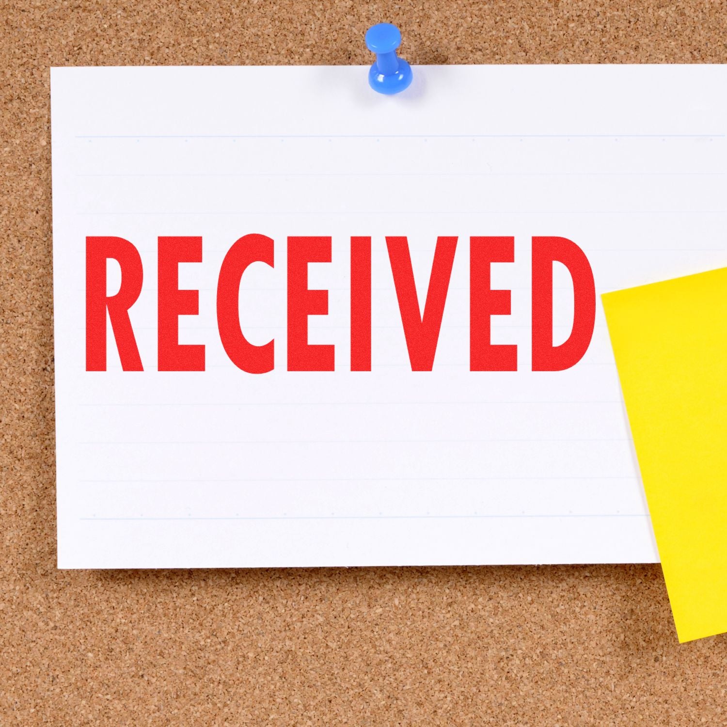 Note pinned to cork board reads RECEIVED, indicating confirmation of document or package receipt.